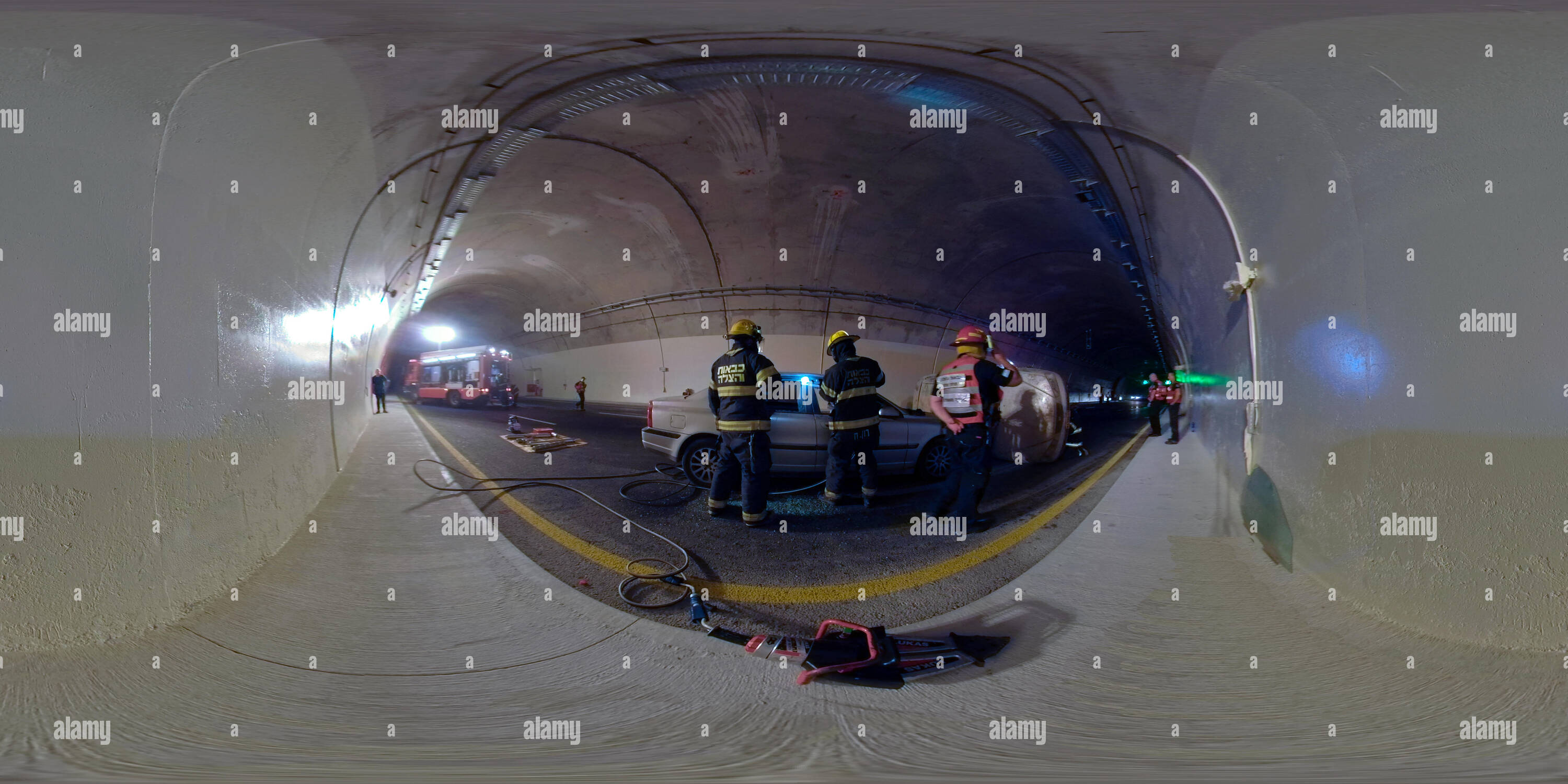 360 degree panoramic view of Firefighters disassemble a car window in car accident during a drill in Kashish Tunnels, Road 6, Israel. 360 photo vr panorama 2:1 aspect ratio for VR