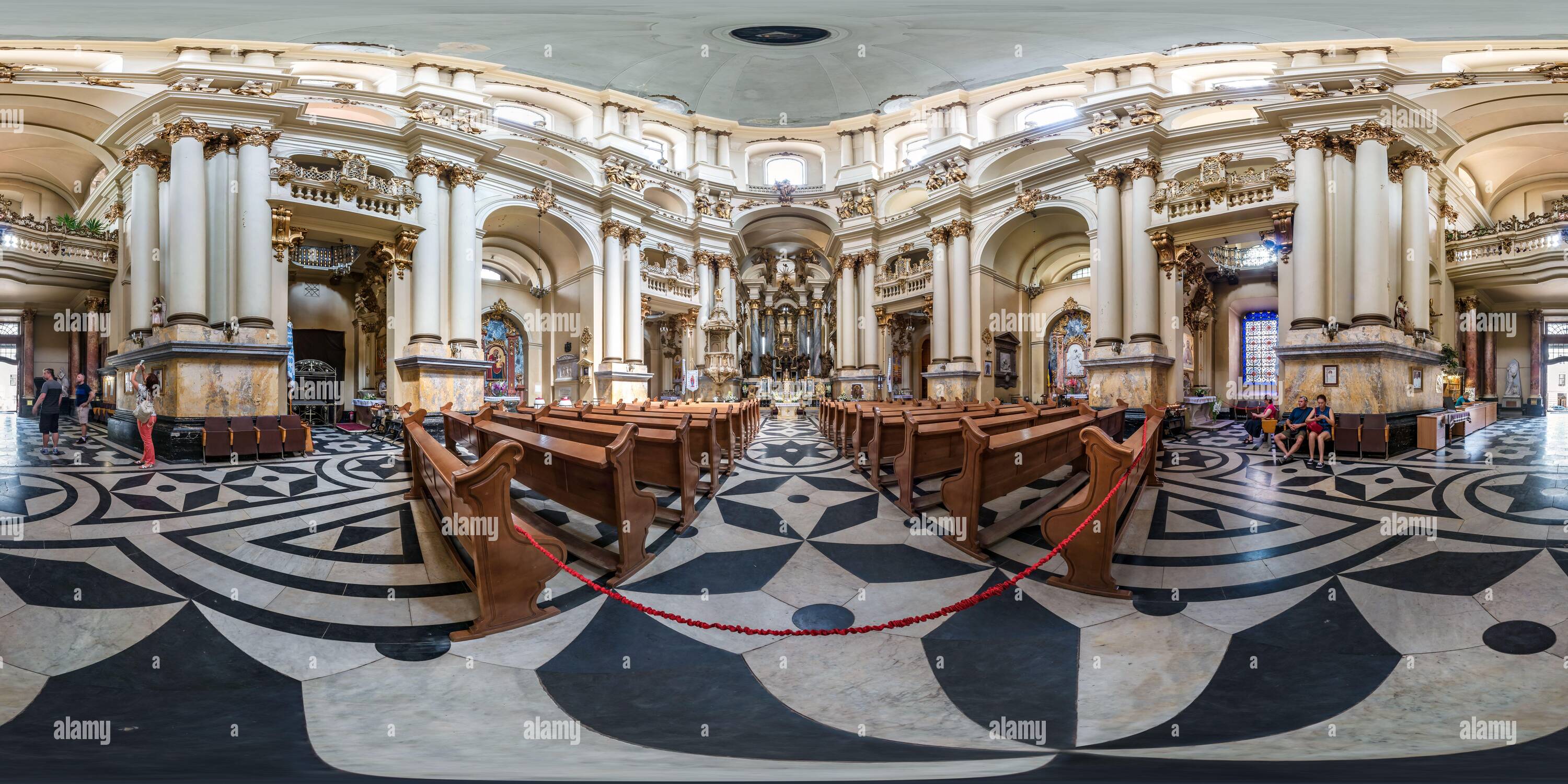 360 degree panoramic view of LVIV, UKRAINE - AUGUST 2019: Full spherical seamless hdri panorama 360 degrees inside interior old baroque uniate Dominican Cathedral in equirectangul