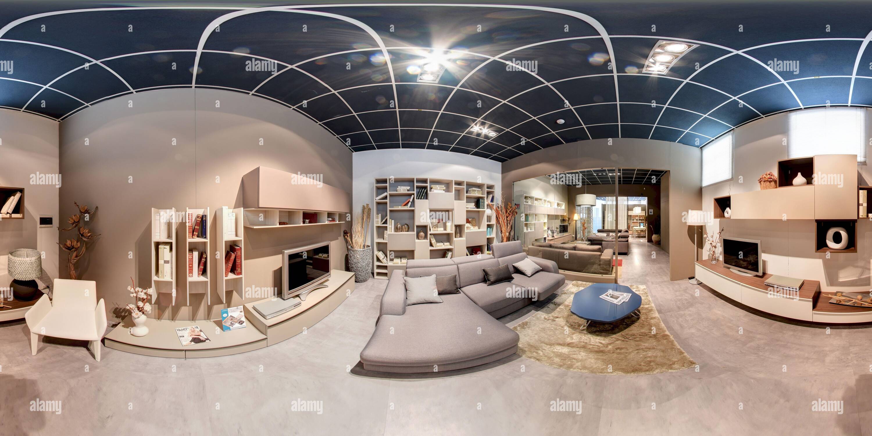 360 degree panoramic view of 360 degree panorama of a modern living room interior in an upmarket property with neutral toned decor and personal effects