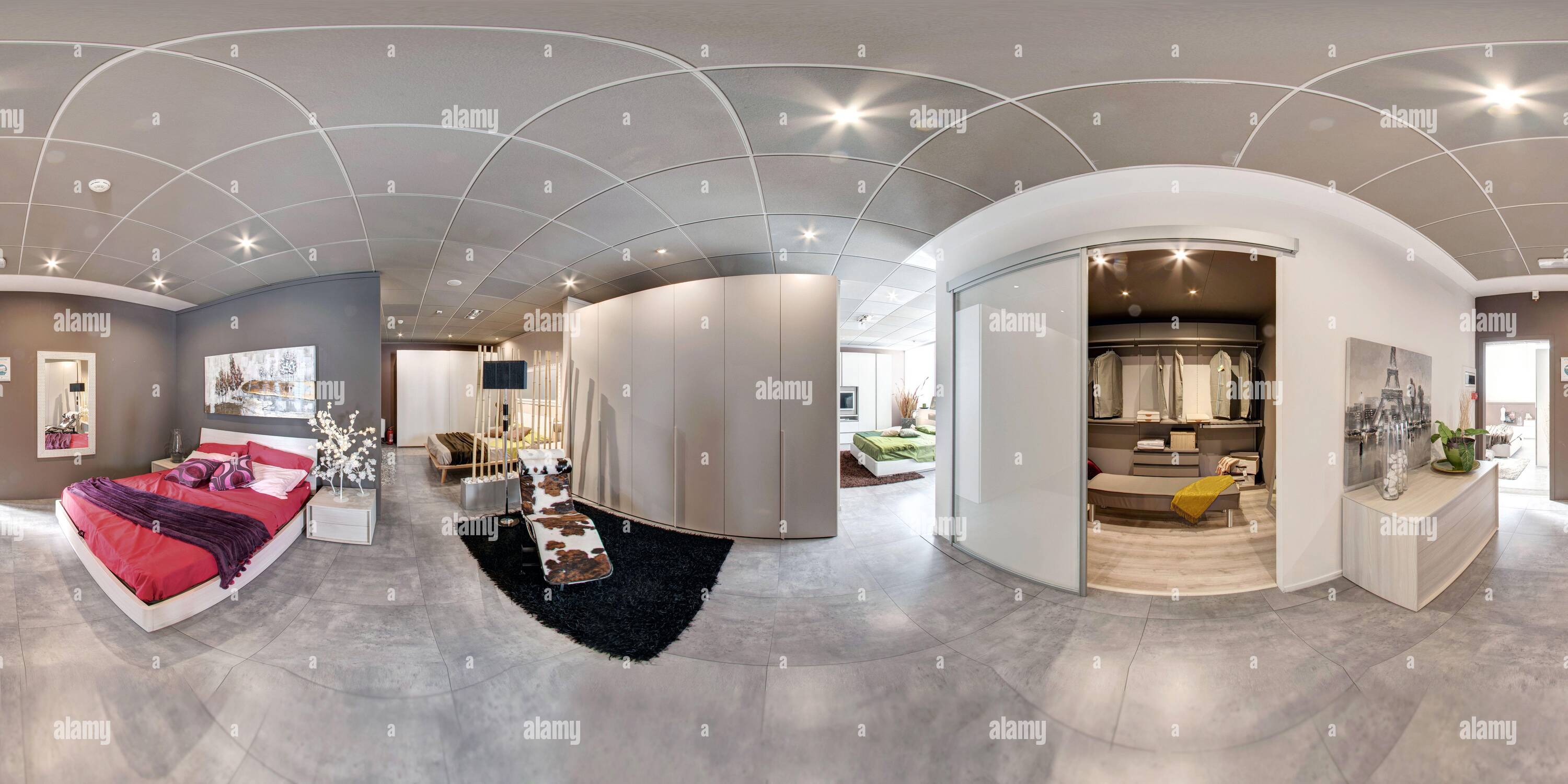 360 degree panoramic view of 360 degree panorama of a modern bedroom showroom with bed and walk-in closet for clothes in an interior design concept