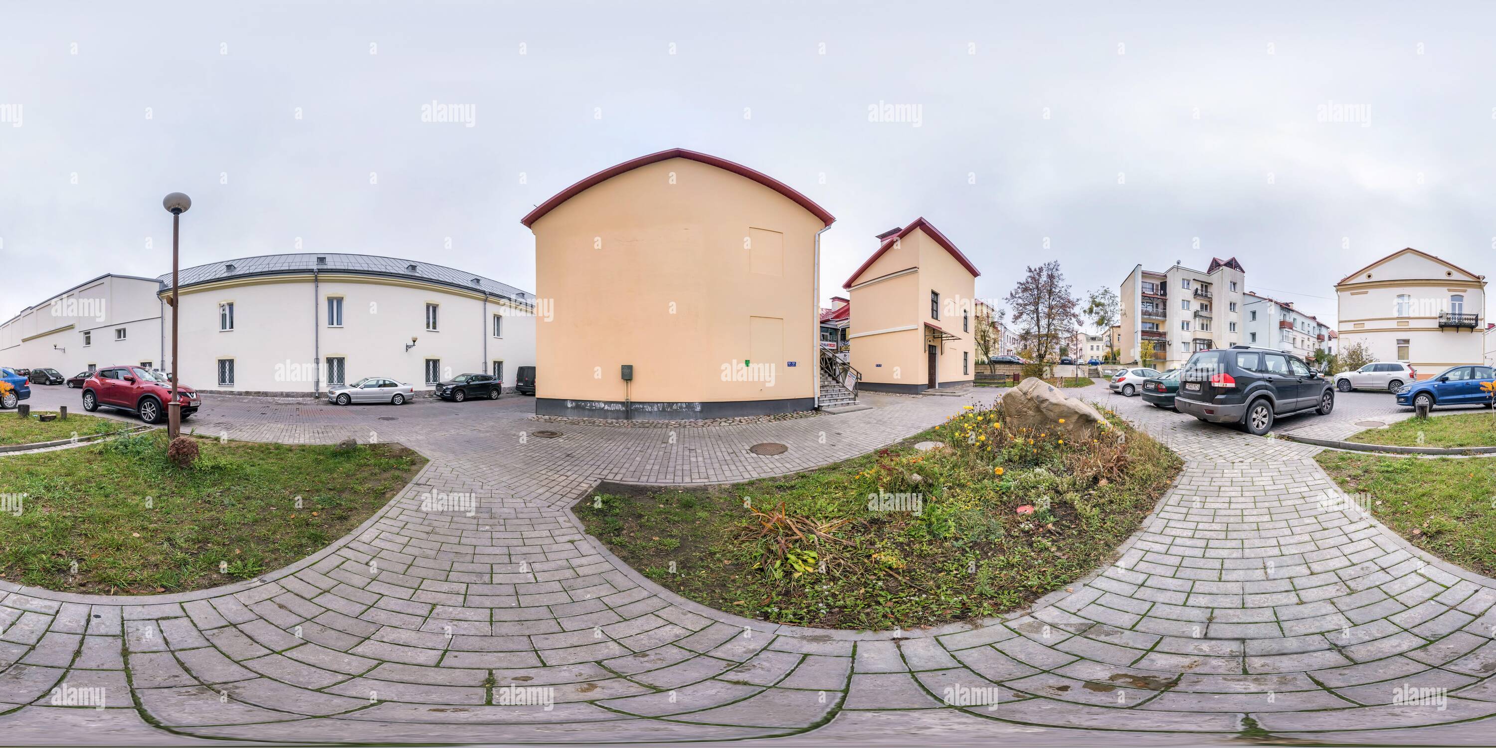360 degree panoramic view of GRODNO, BELARUS -  NOVEMBER 2020: full seamless spherical hdri panorama 360 degrees angle near old houses in city bystreet near parking in equirectang