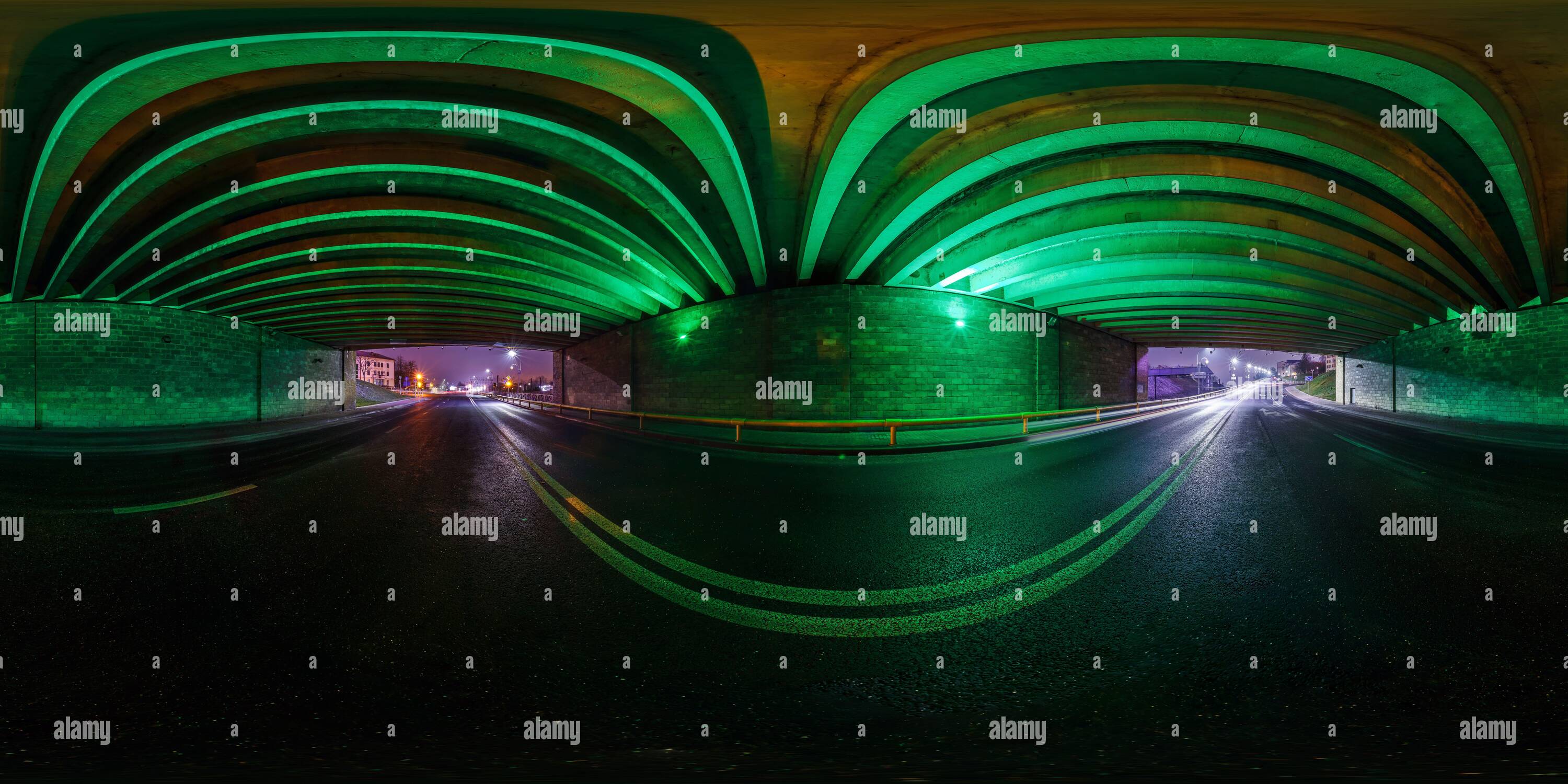 360 degree panoramic view of full seamless spherical hdri panorama 360 degrees angle view on no traffic highway inside tunnel under сoncrete bridge in light of green spotlight