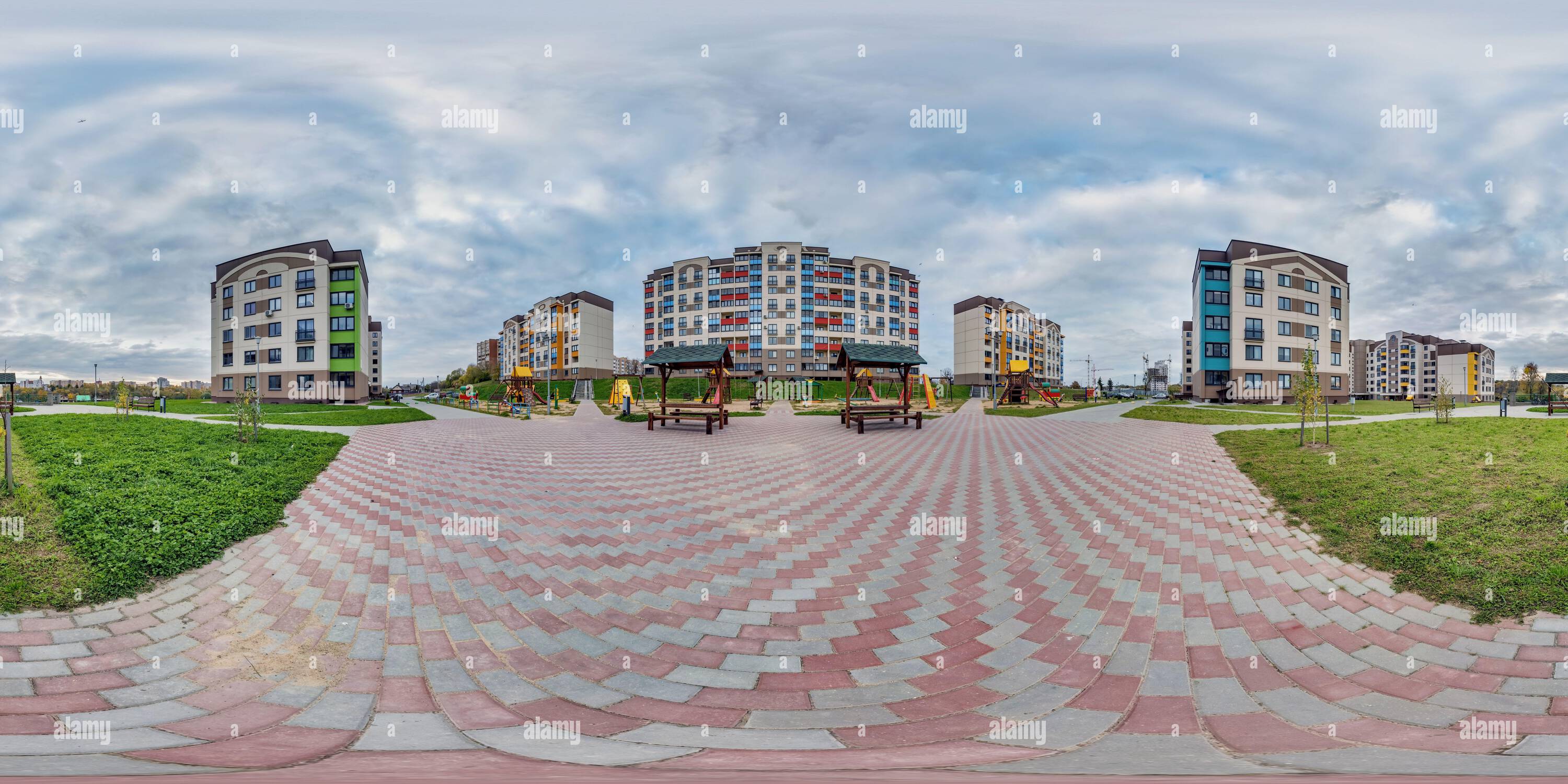 360 degree panoramic view of 360 hdri panorama near playground in middle of modern multi-storey multi-apartment residential complex of urban development in equirectangular seamles