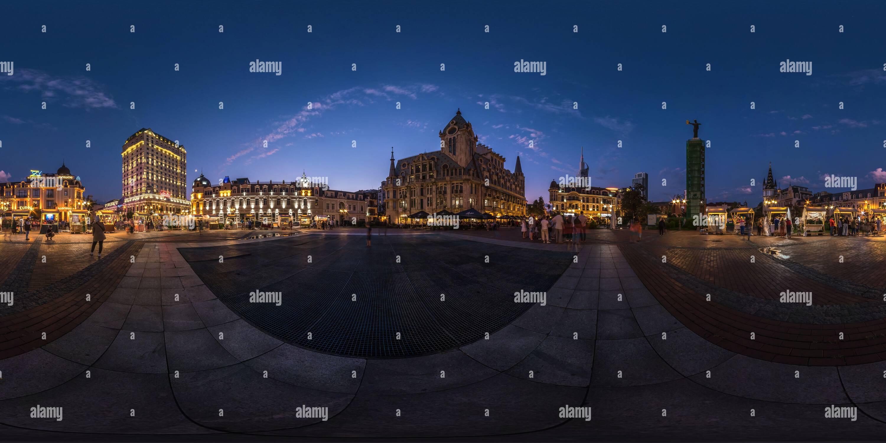 360 degree panoramic view of BATUMI, GEORGIA - SEPTEMBER 2021: full seamless spherical night panorama 360 degrees angle view in central square of city with crowds of tourists in c