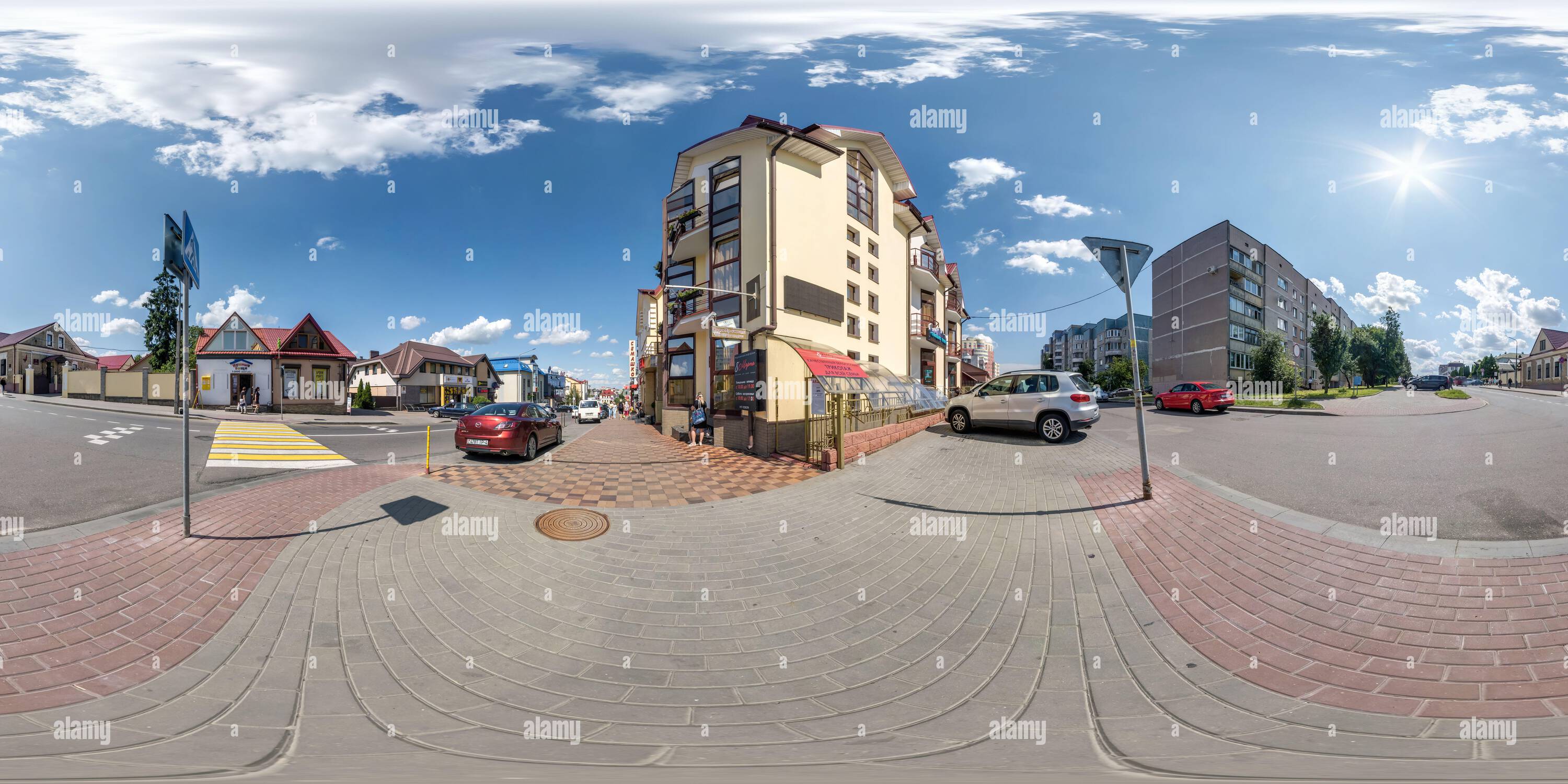 360 degree panoramic view of GRODNO, BELARUS - MAY 2021: full seamless spherical hdr 360 panorama on crossroads street near multistory building area of urban development in sunny