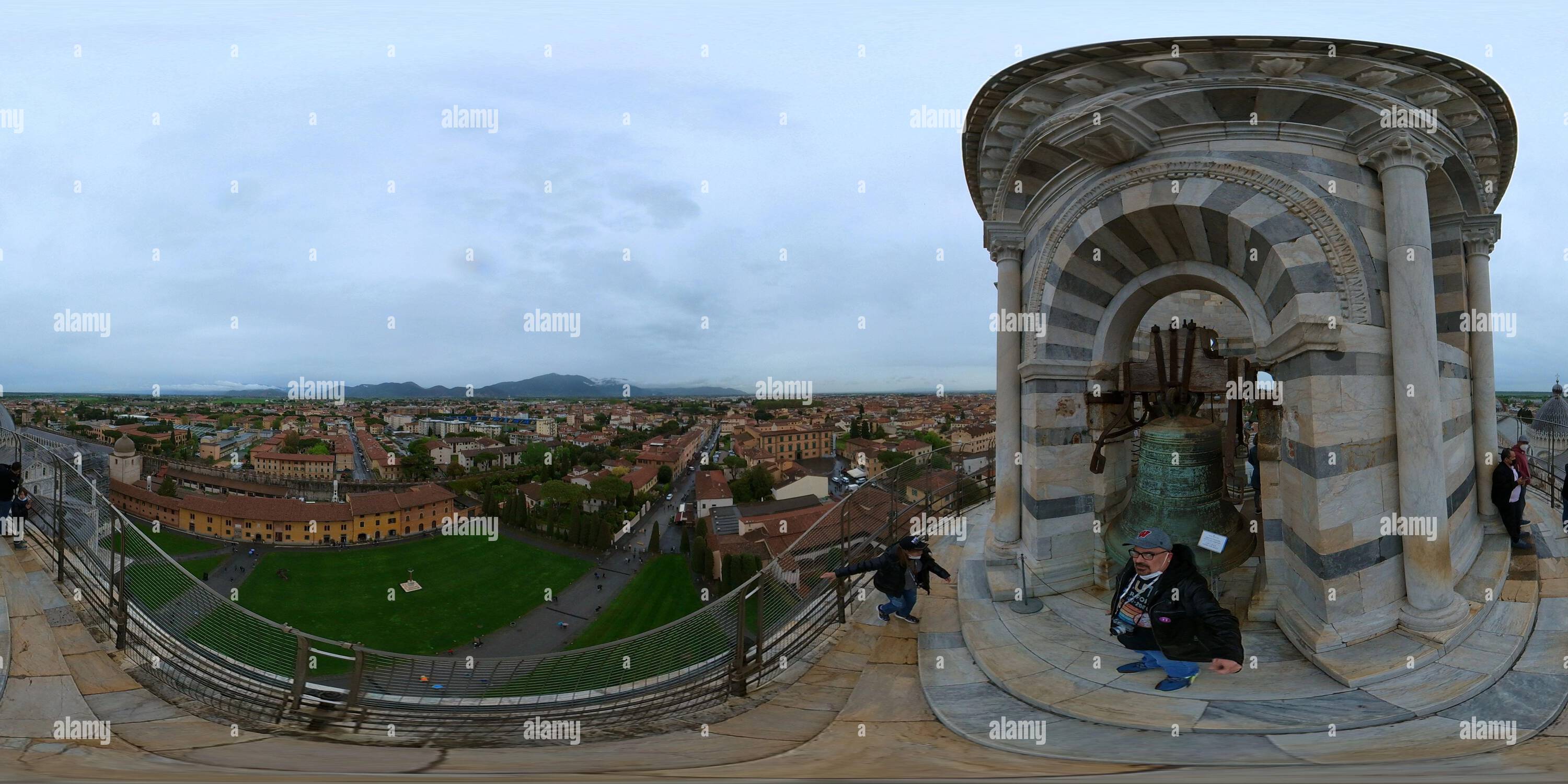 360 degree panoramic view of People standing and climbing at the top of the Leaning Tower of Pisa in Pisa, Italy