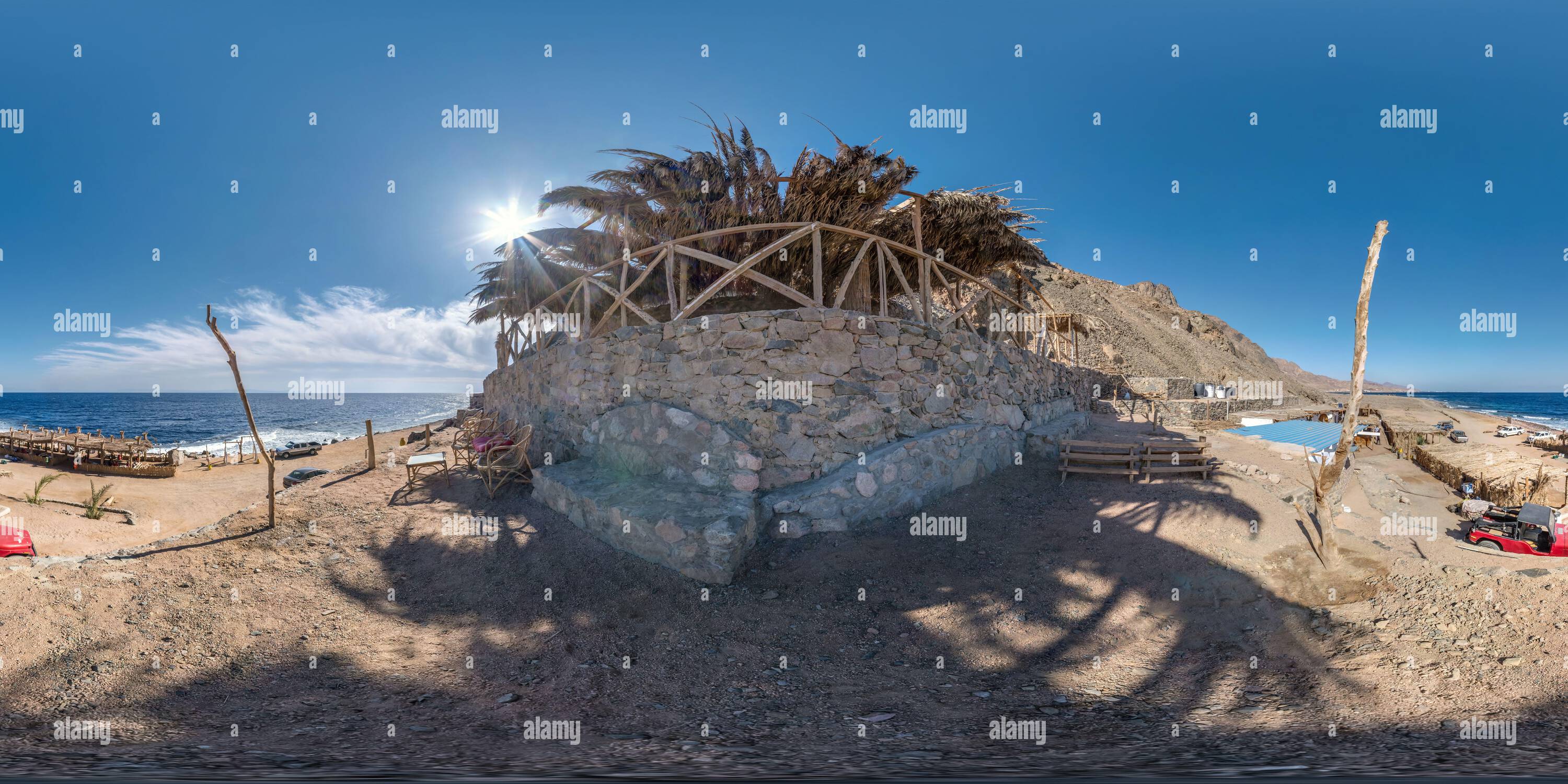 360 degree panoramic view of full hdri seamless spherical 360 panorama near thatched hut with daybeds and cushions for relaxing or palm tree hut on Red Sea coast in equirectangula