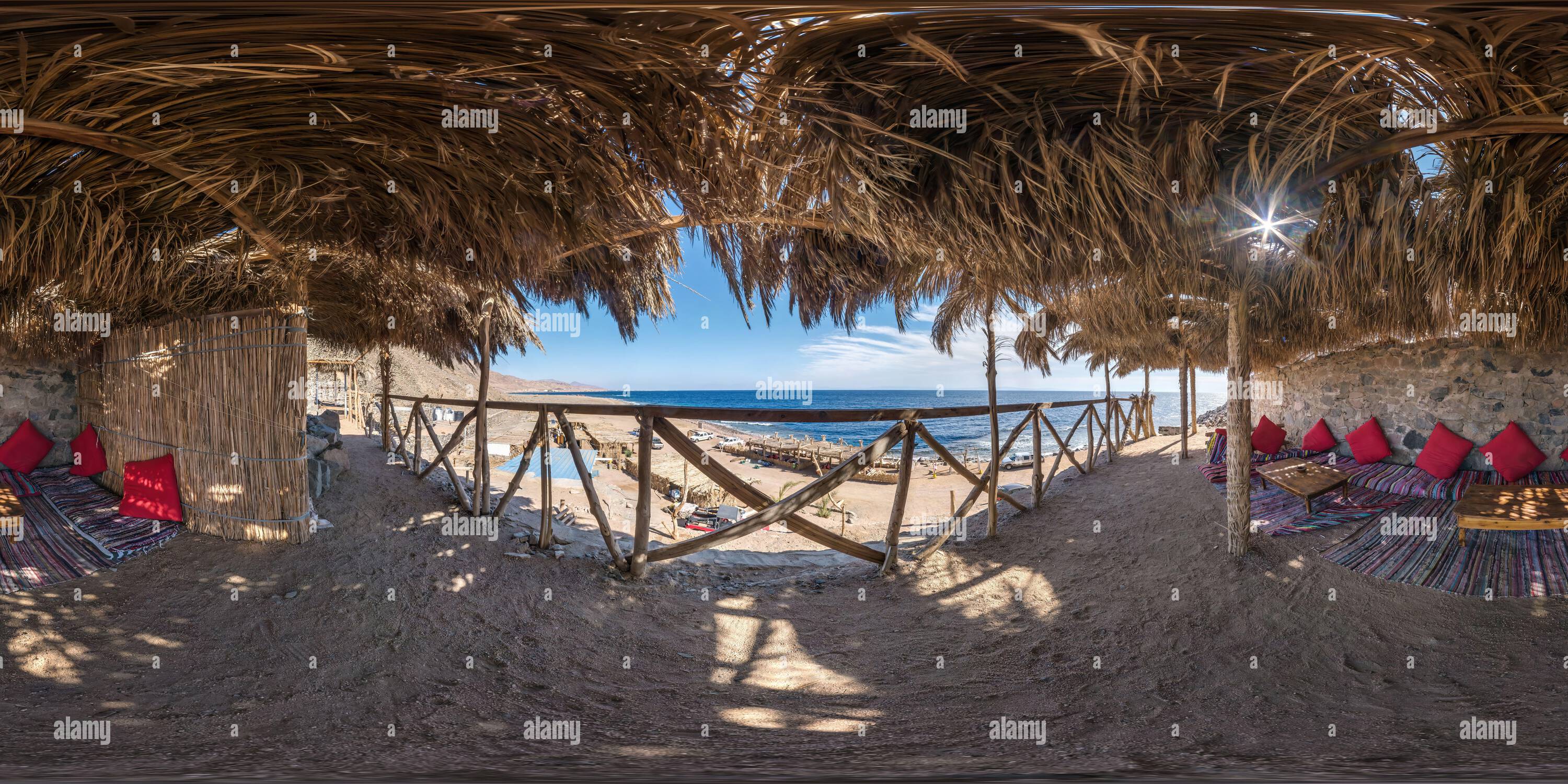 360 degree panoramic view of full hdri seamless spherical 360 panorama thatched hut with daybeds and cushions for relaxing or palm tree hut on Red Sea coast in equirectangular pro
