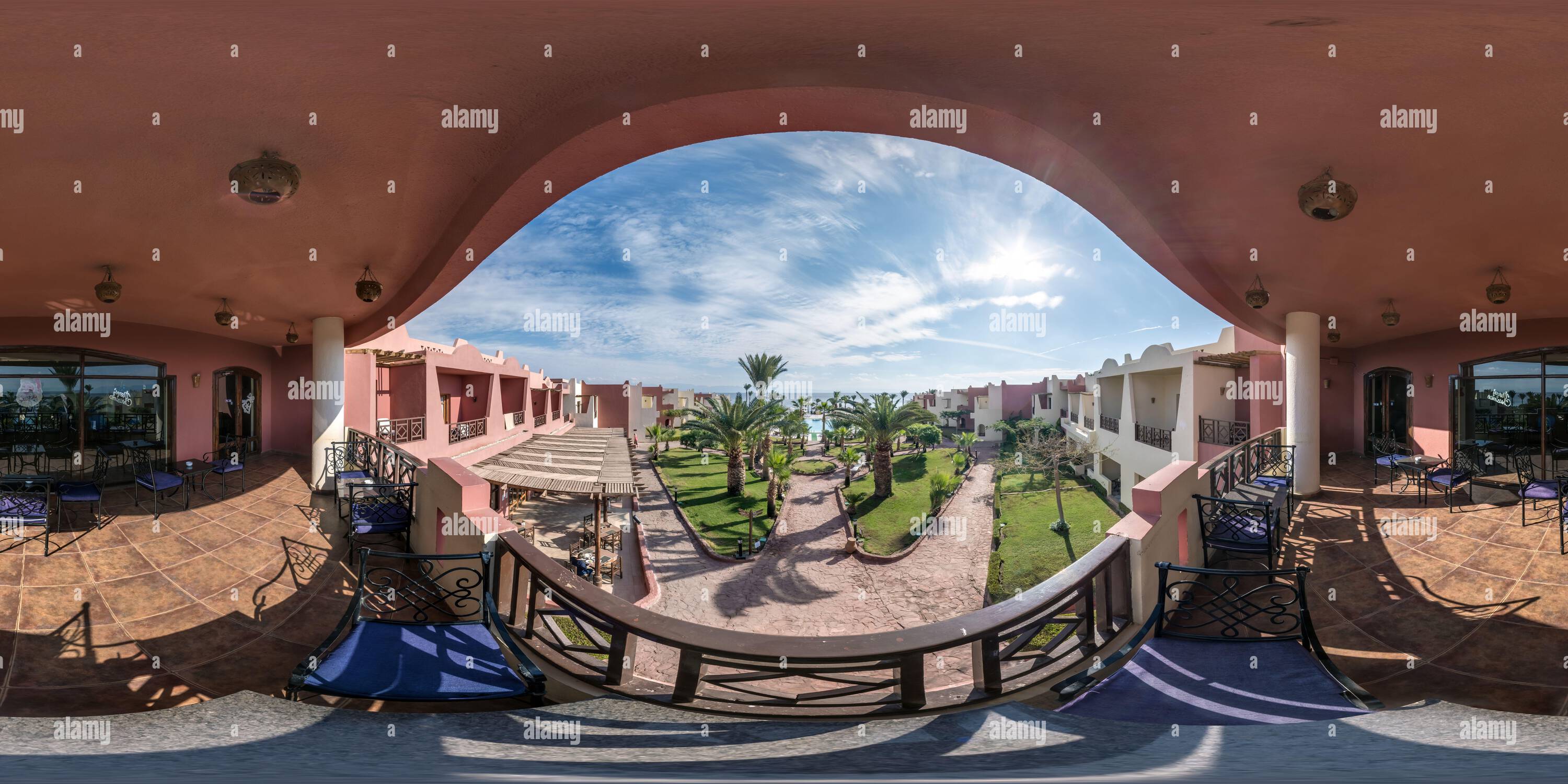 360 degree panoramic view of DAHAB, EGYPT - DECEMBER 2021: full seamless spherical hdr 360 panorama view on second floor of balcony or terrace overlooking palm trees in equirectan