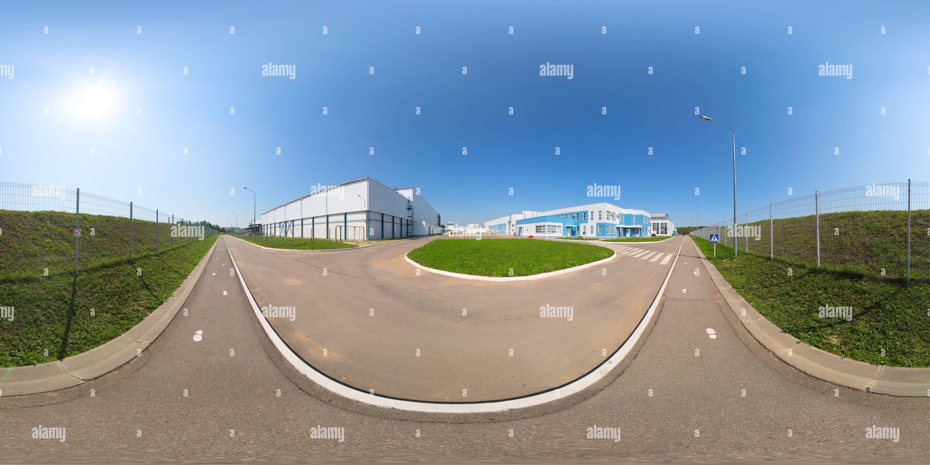 360 degree panoramic view of Seamless full spherical 360 degree panorama in equirectangular projection of outdoor industrial area with white buildings and metal mesh fence and aph