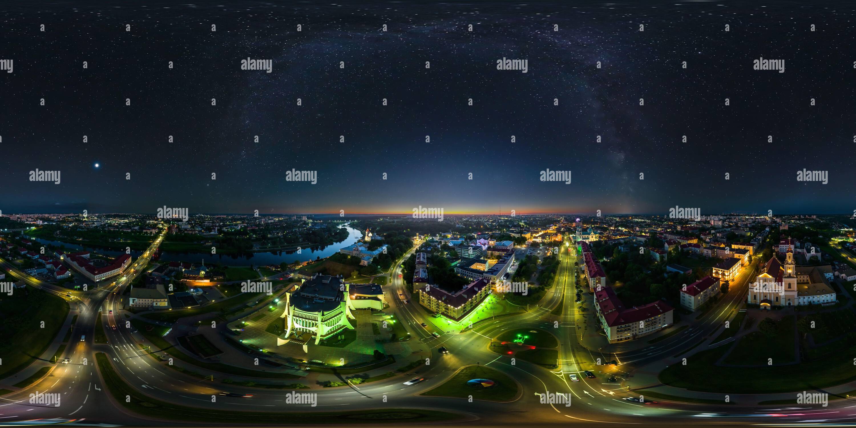 360 degree panoramic view of aerial seamless spherical 360 night panorama overlooking old town, urban development, historic buildings, crossroads with bridge across river with sta