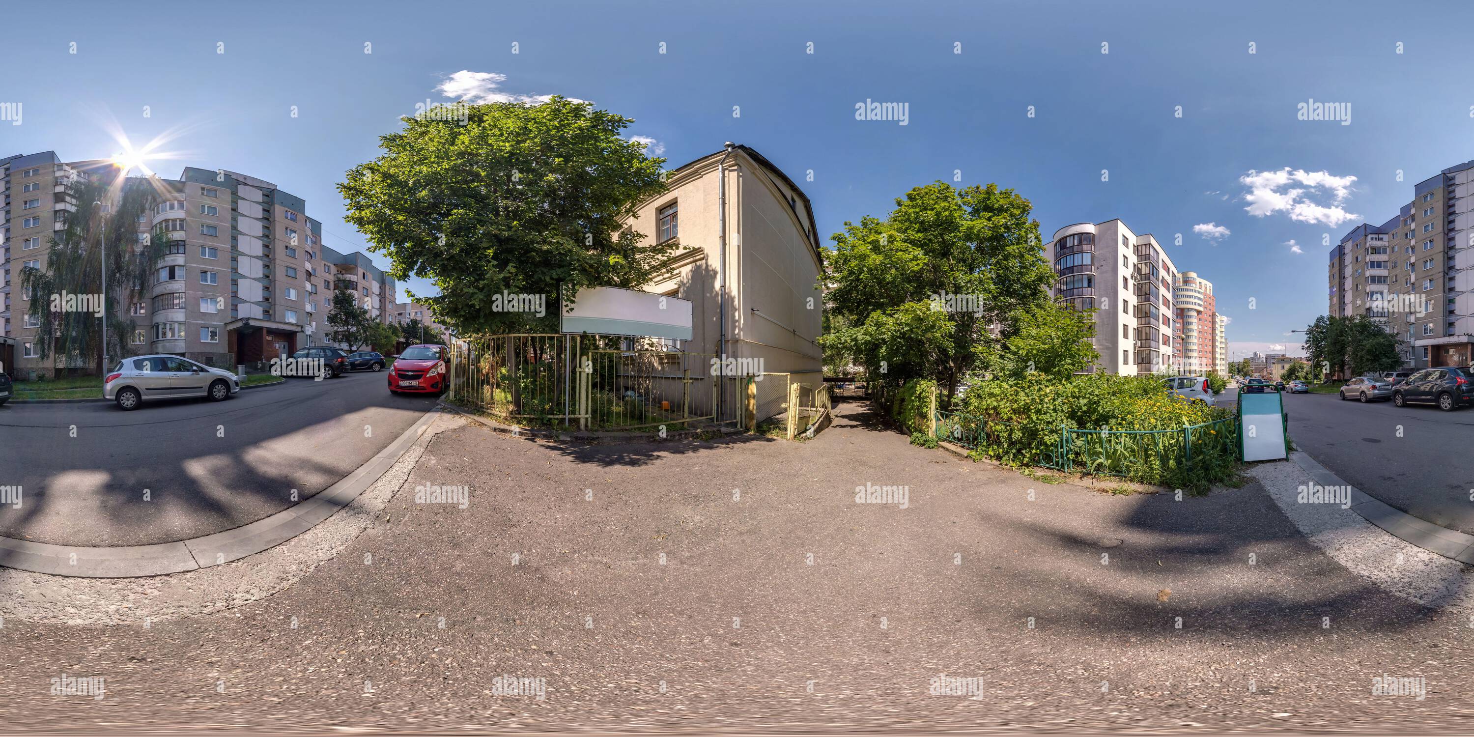 360 degree panoramic view of GRODNO, BELARUS - JULY 2021: full seamless spherical hdri panorama 360 view on crossroads street near multistory building area of urban development in