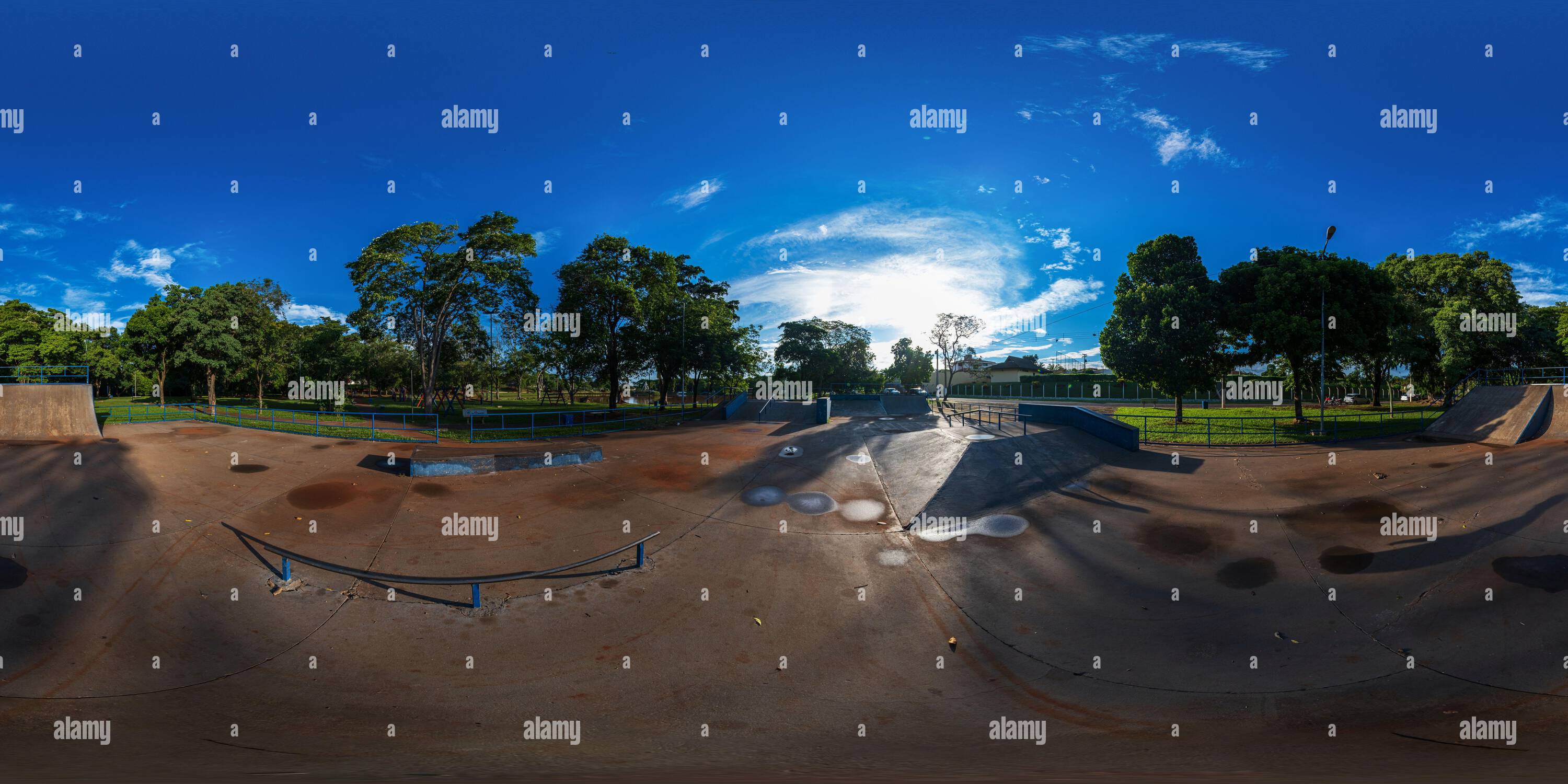 360 degree panoramic view of Skateboard track with some puddles of water in sunny morning - 360 degrees