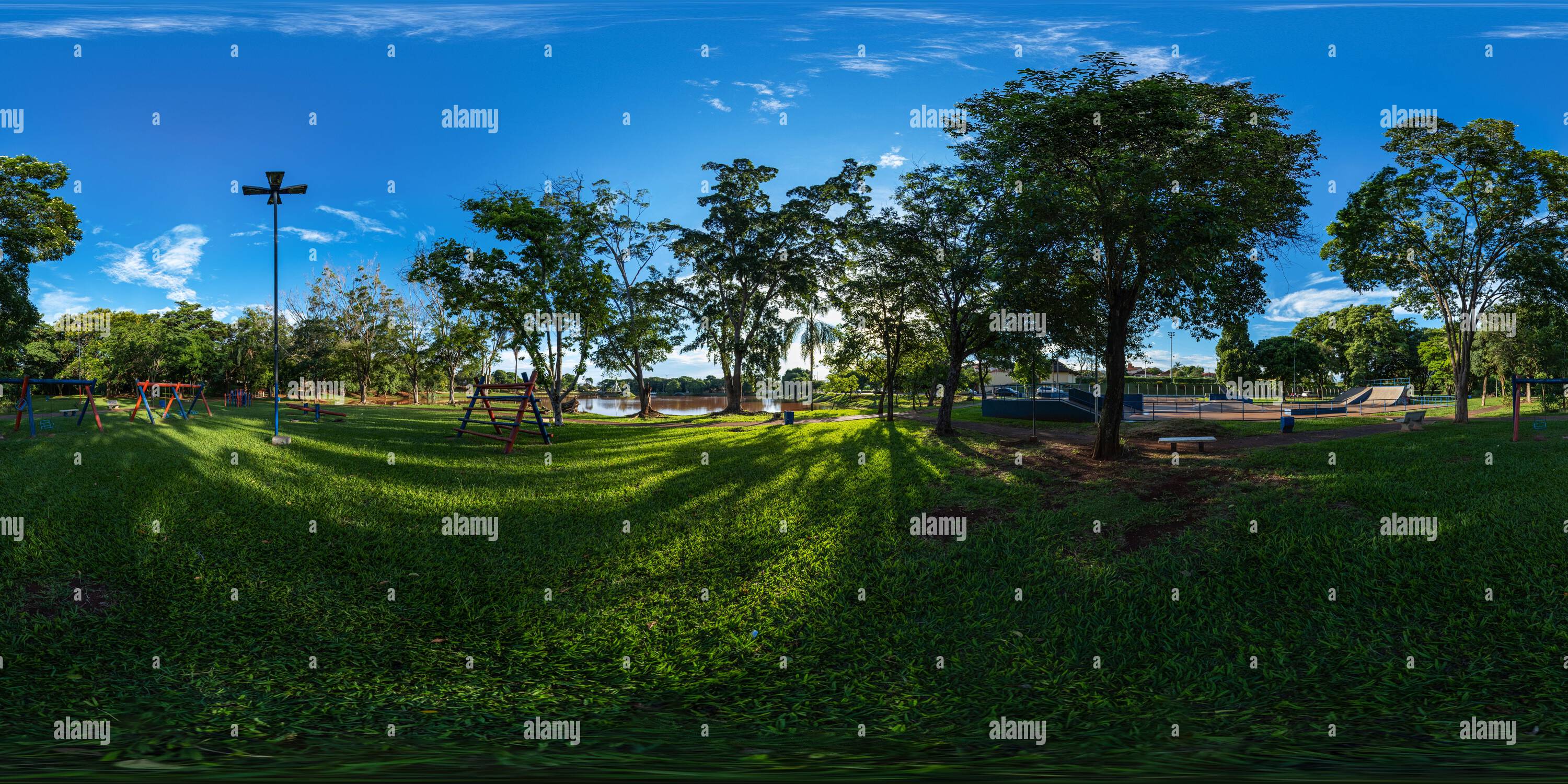 360 degree panoramic view of Playground next to lake and skate park in sunny morning - 360 degrees