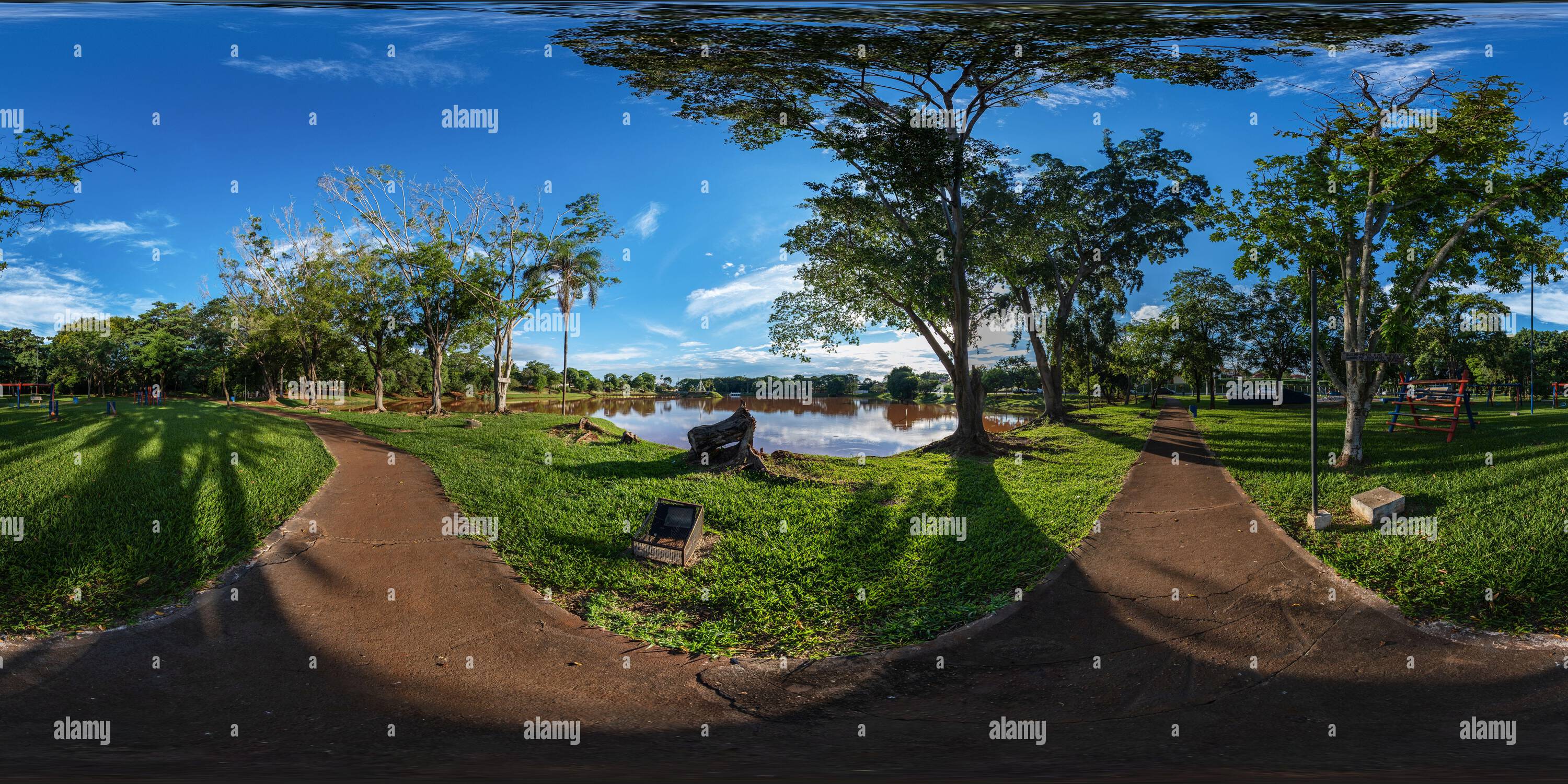 360 degree panoramic view of square with pedestrian path next to playground, lake and skate park - 360 degrees