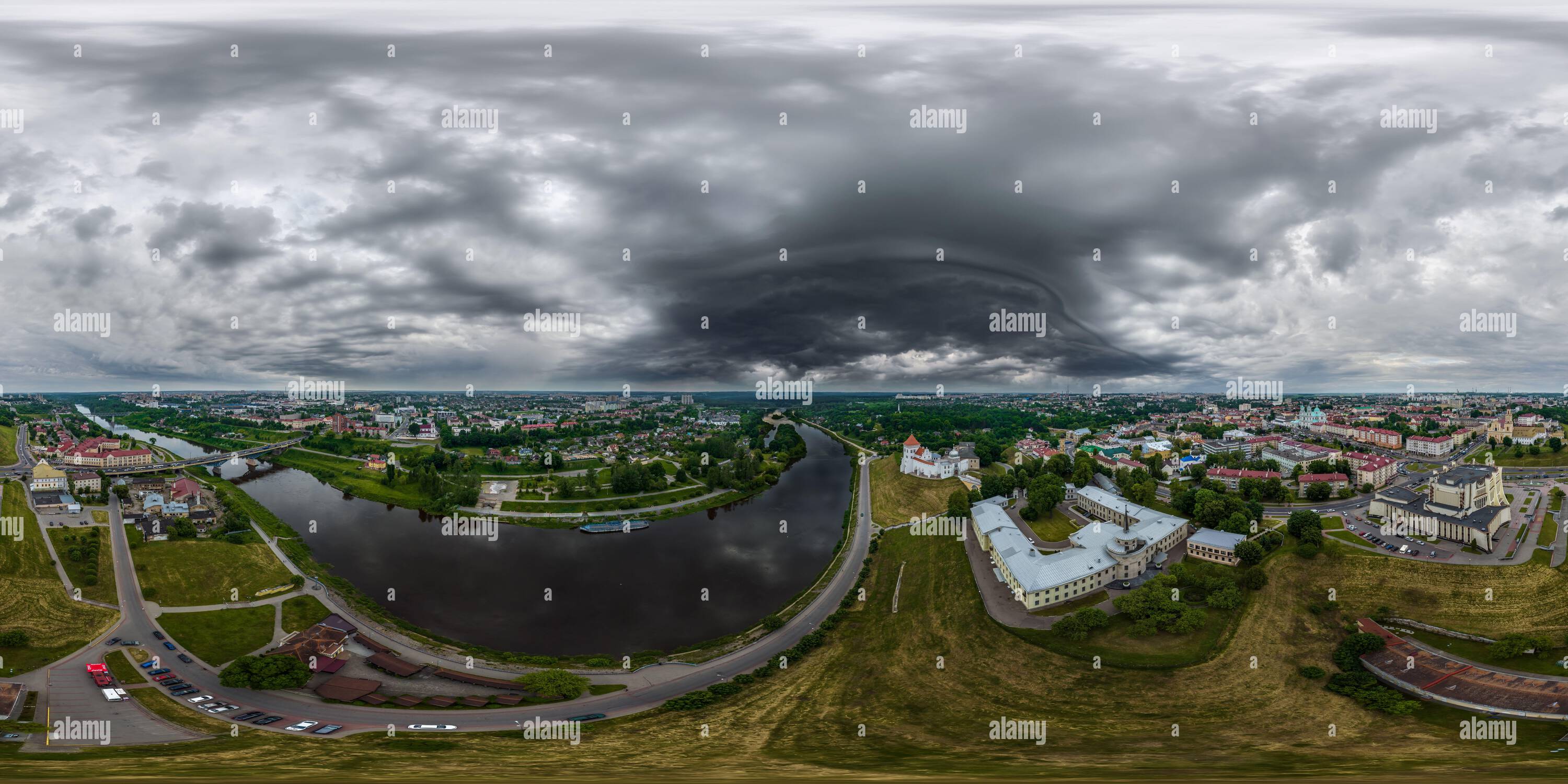 360 degree panoramic view of aerial seamless spherical 360 hdri panorama overlooking old town, historic buildings with bridge across wide river with dark sky with storm black clou