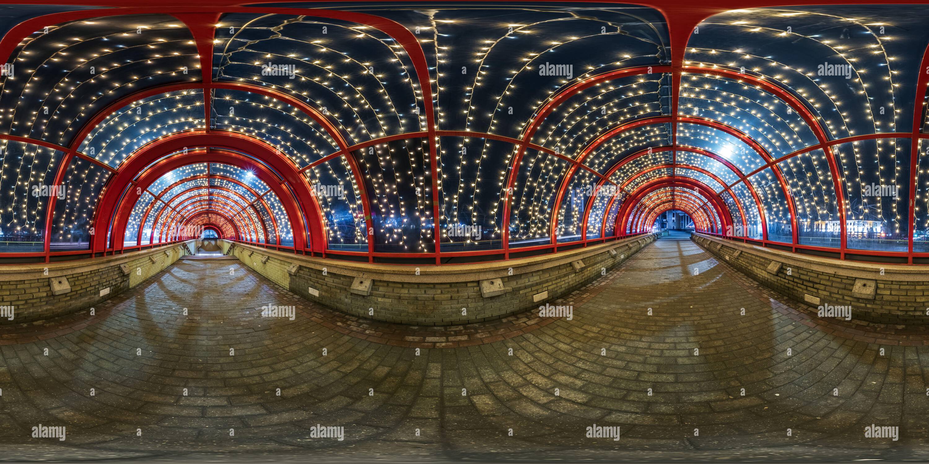 360 degree panoramic view of spherical night 360 panorama in festively lit underground passage tunnel with red frame arch and transparent dome and concrete staircase in equirectan