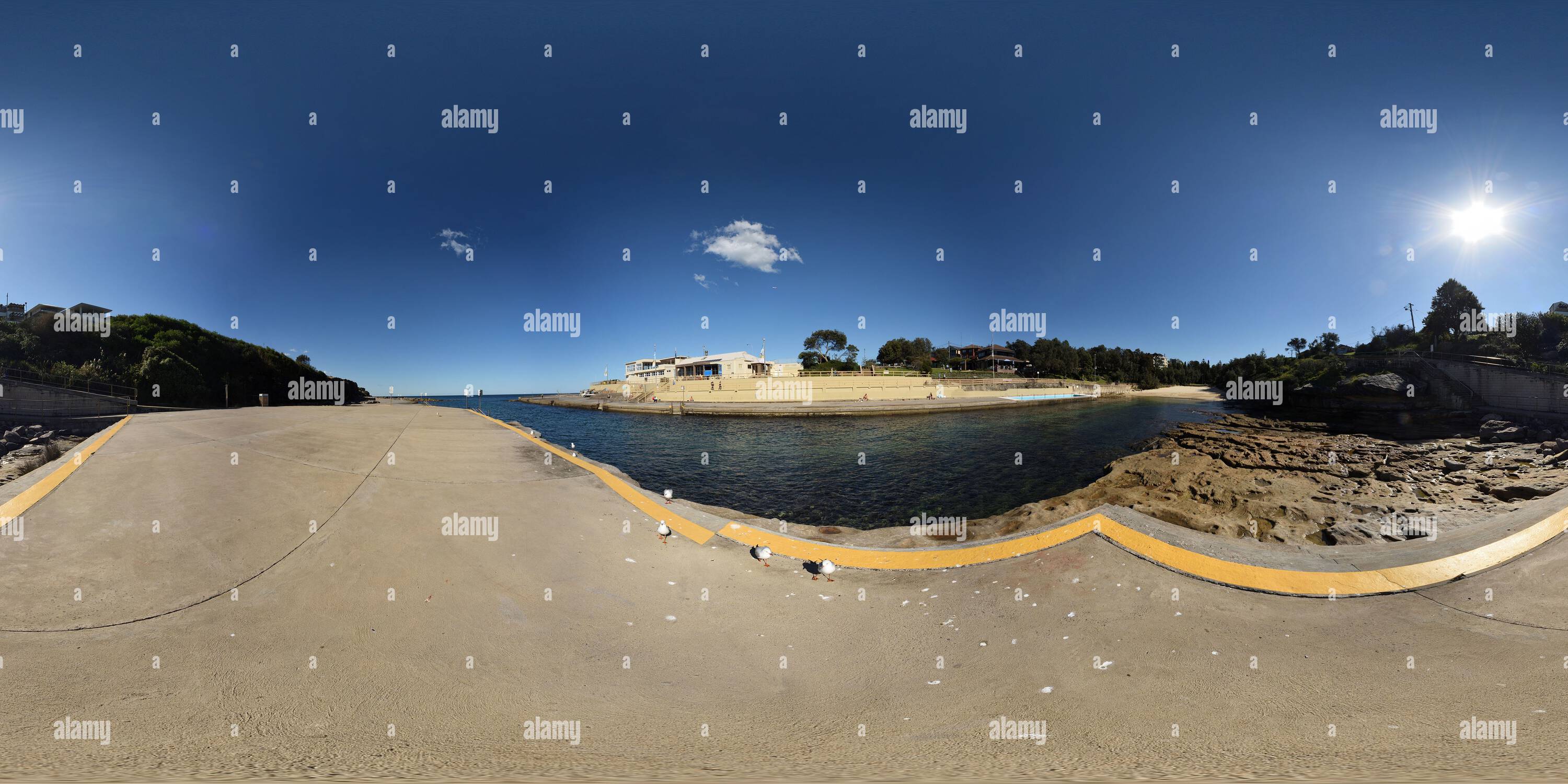 360 degree panoramic view of 360° Panorama - A sea of concrete, the northern sunbathing platform at Clovelly Ocean pool.