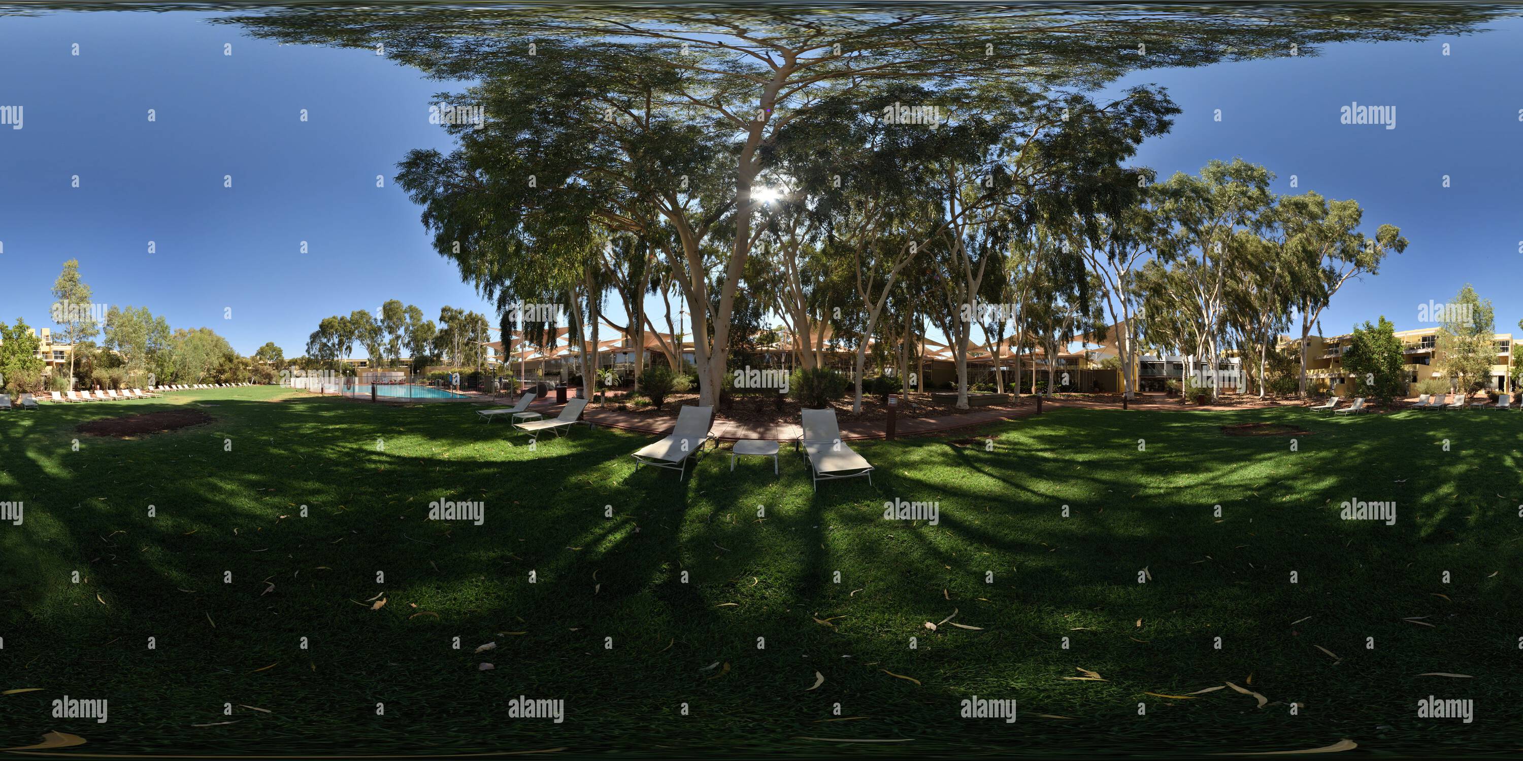 360 degree panoramic view of Sun lounges and Gum trees, Grassed Area and Fenced Pool at Sails Resort, Yulara, Northern Territory, 360° Panorama