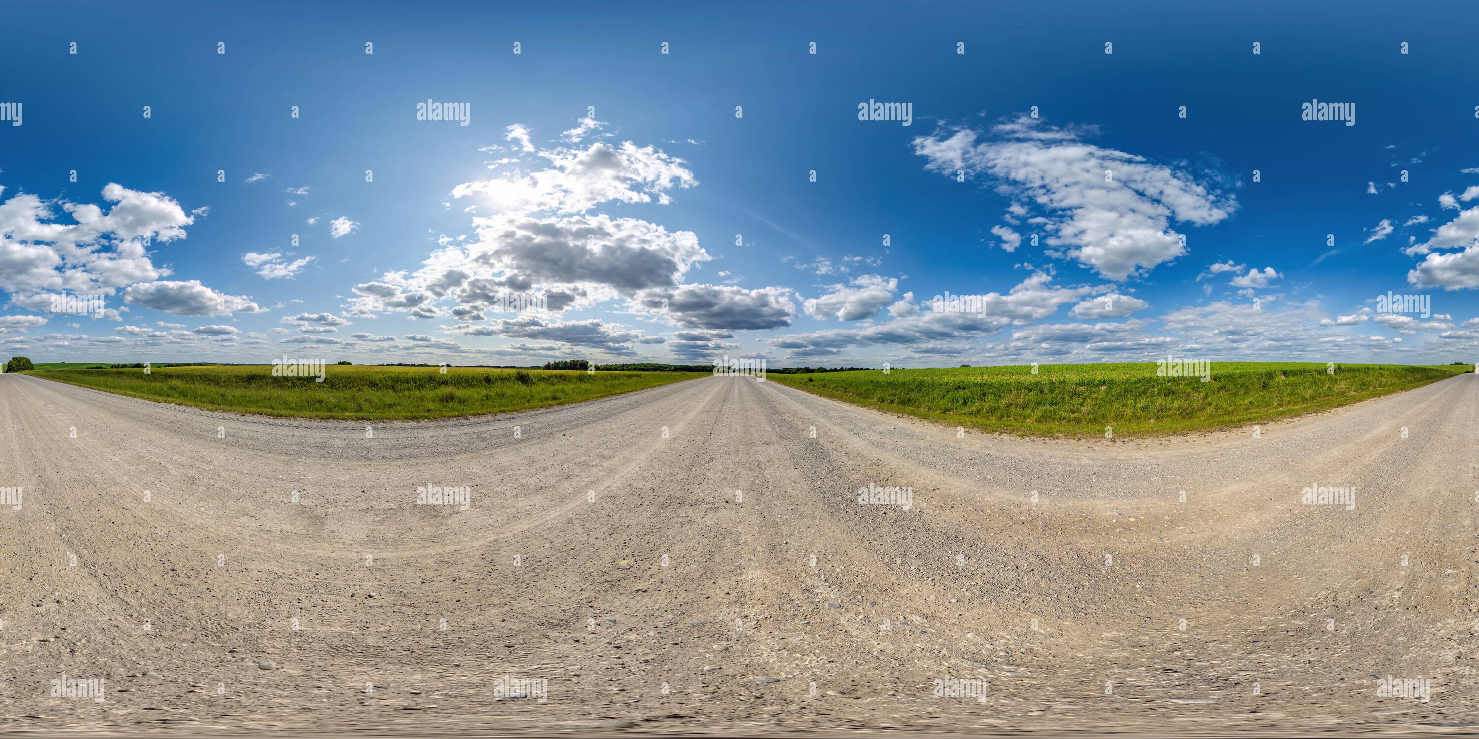 360° view of 360 hdri panorama on white sand gravel road with clouds on ...