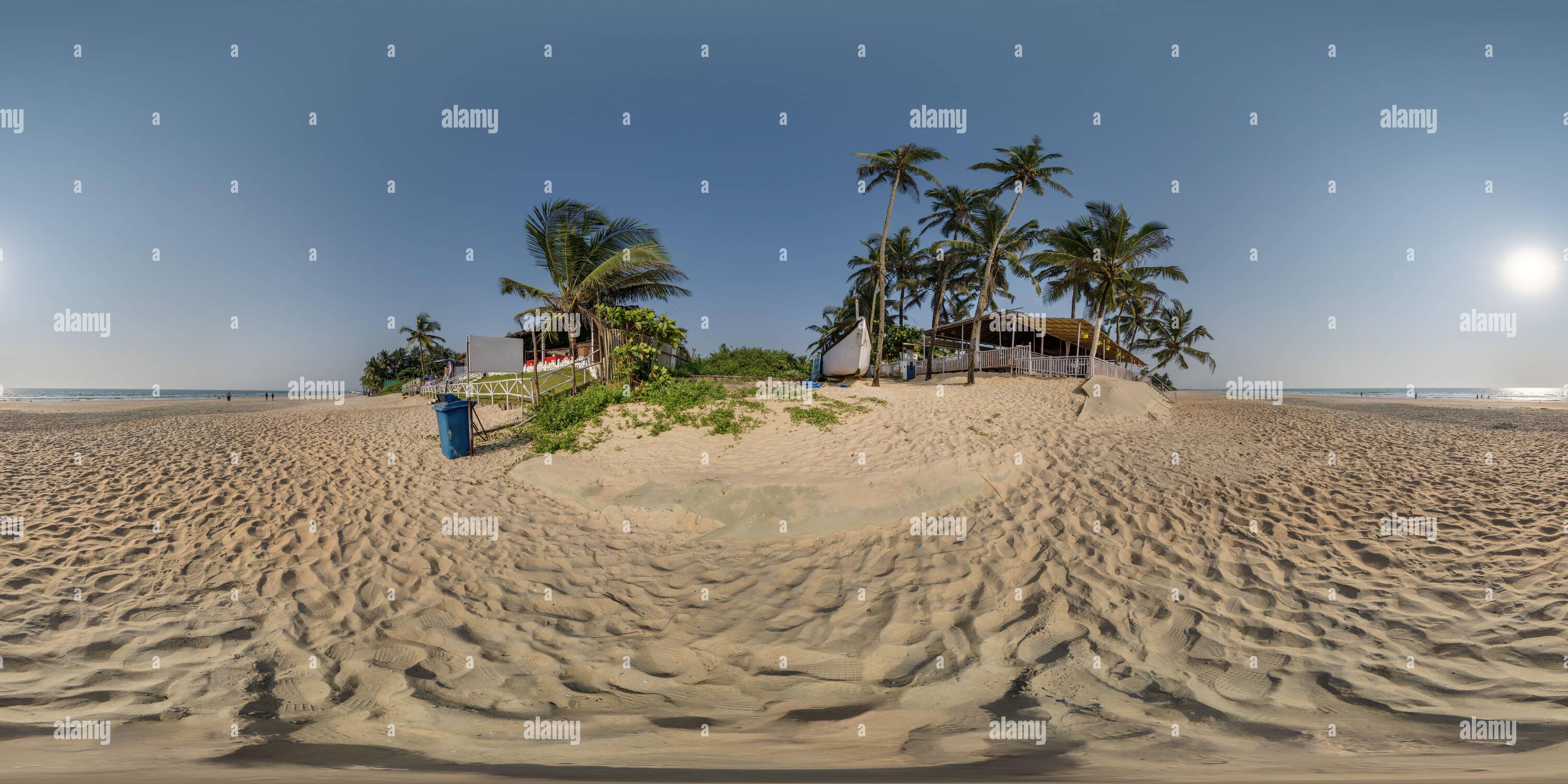 360 degree panoramic view of 360 hdri panorama with coconut trees on ocean coast near tropical shack or open air cafe on beach in equirectangular spherical seamless projection,
