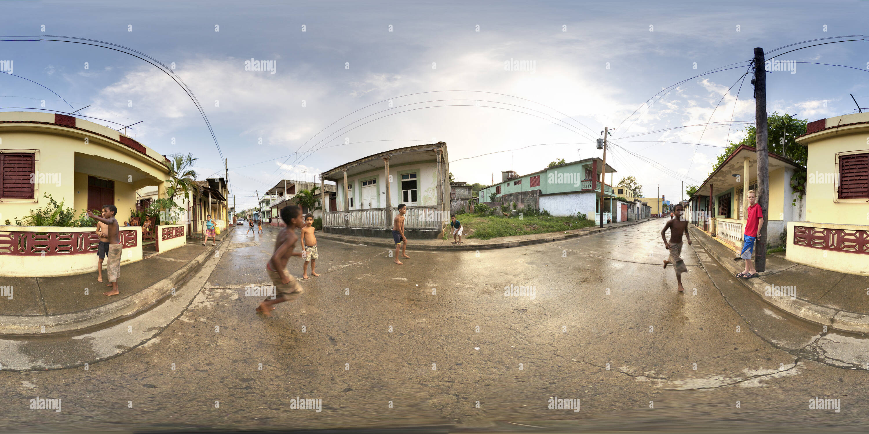 360 degree panoramic view of Kids playing street baseball