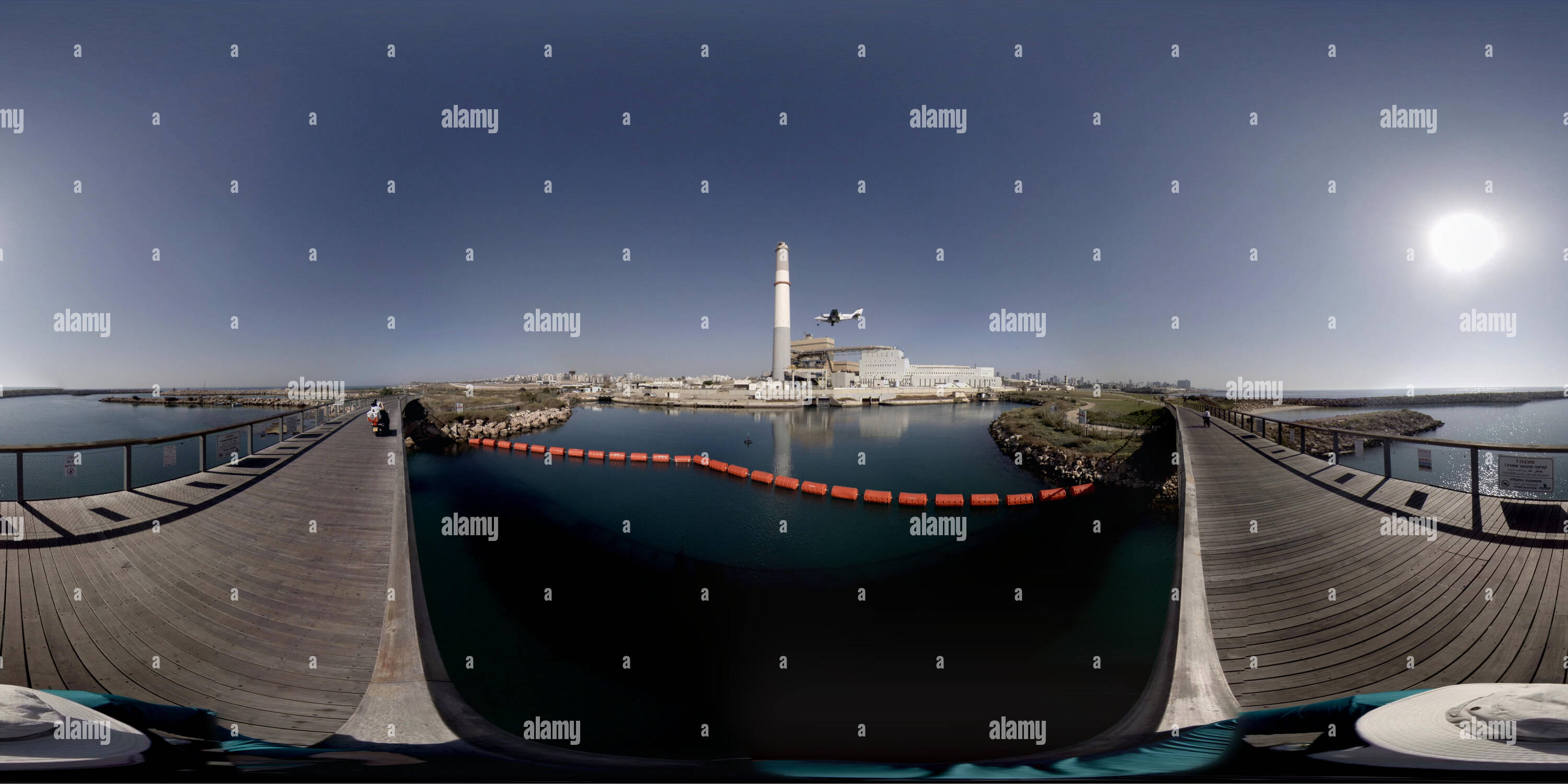 360 degree panoramic view of Airplane landing in Sde Dov airport near Reading Power Station. The Reading Power Station is a power station supplying electrical power to the Tel Avi