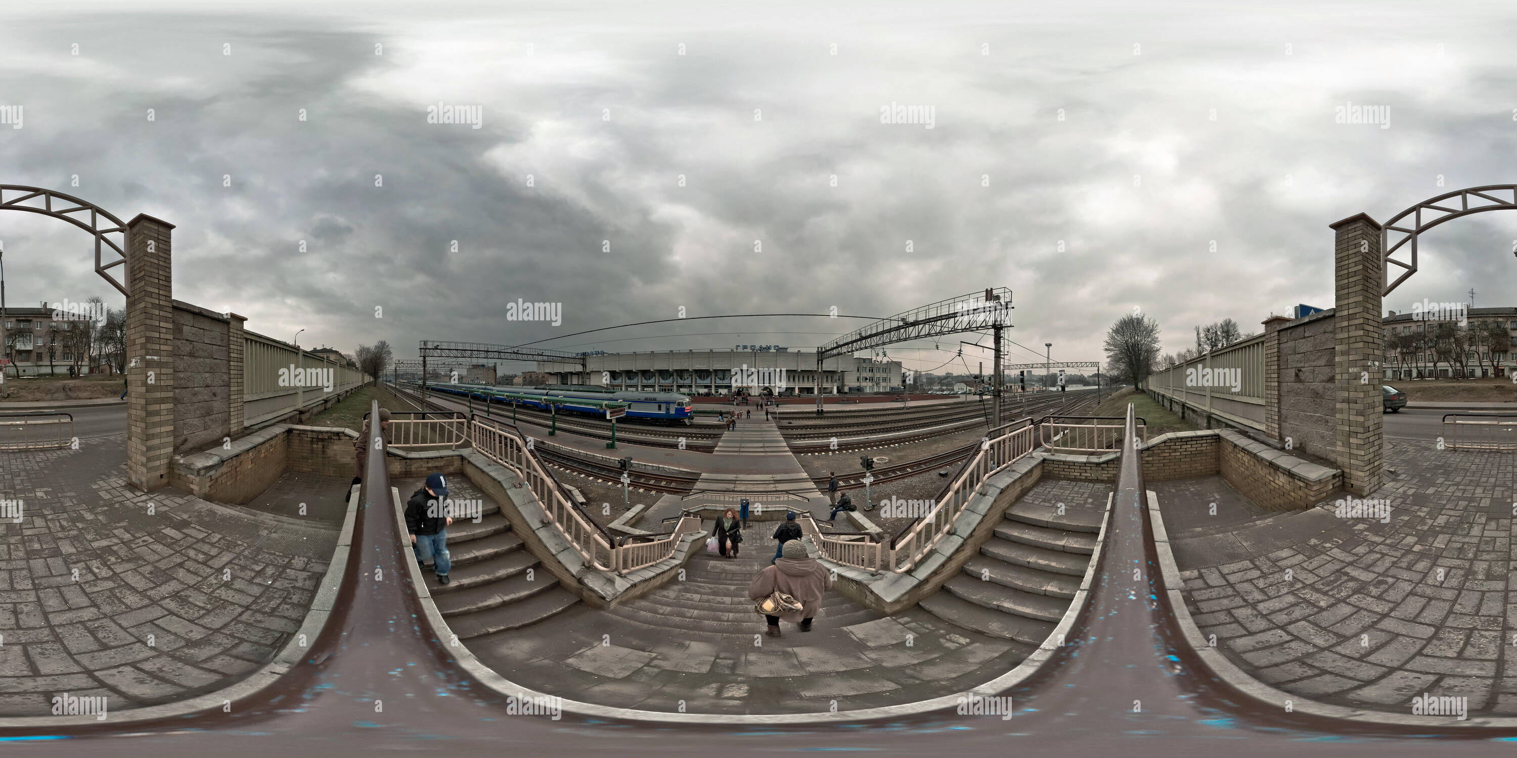 360 degree panoramic view of GRODNO, BELARUS - NOVEMBER 20, 2012: Panorama near modern railway station before storm with trains.  Full 360 by 180 degree seamless spherical panoram