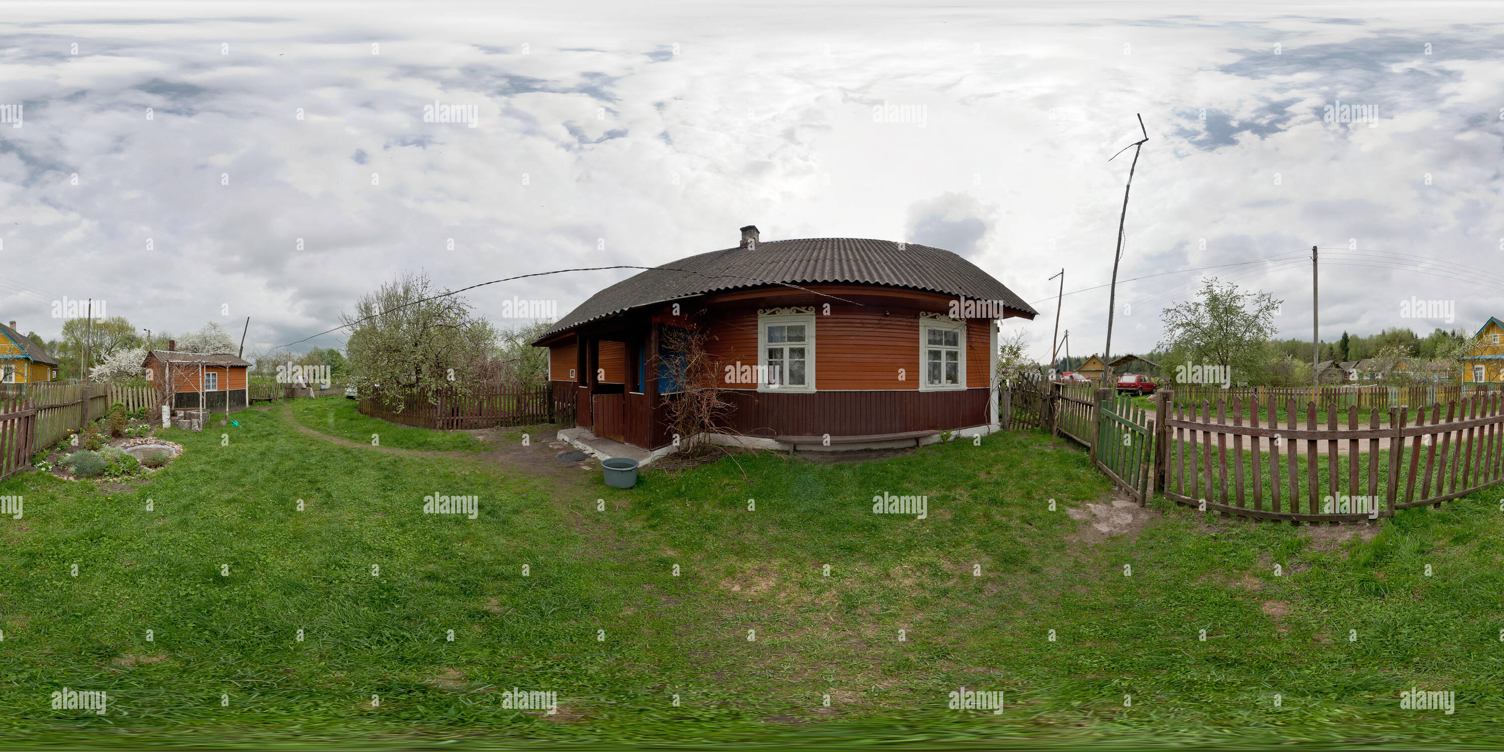 360 degree panoramic view of GRODNO, BELARUS - MAY 2, 2012: 360 panorama view near wooden house in village in summer day. Full 360 by 180 degrees seamless panorama  in equirectang