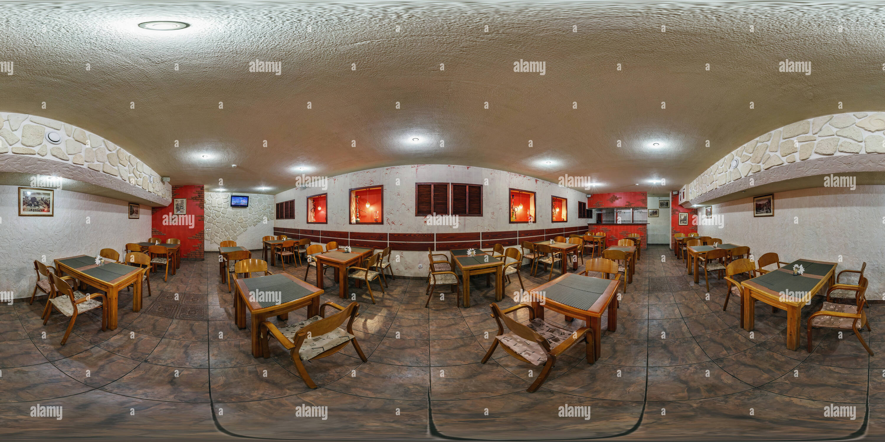 360 degree panoramic view of GOMEL, BELARUS - FEBRUARY 14, 2012: 360 panorama in Inside interior of stylish cafe with red windows. Full 360 degree angle view seamless panorama in