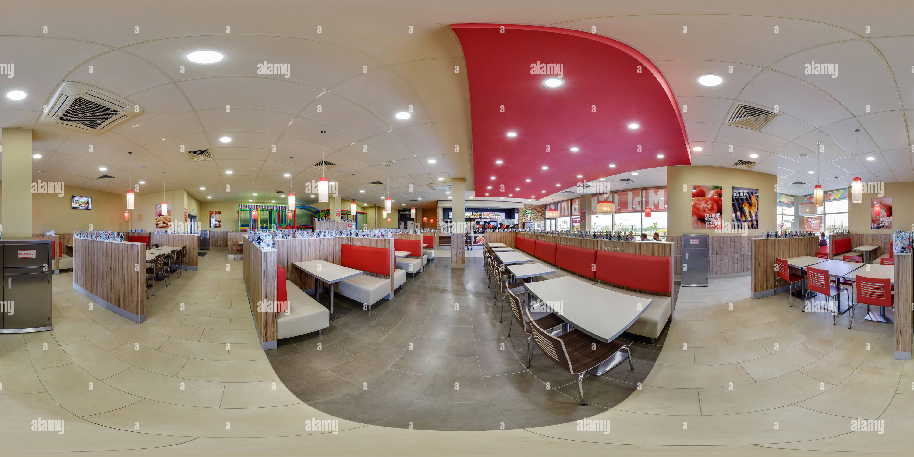 360 degree panoramic view of MINSK, BELARUS - MAY 26, 2017: panorama 360 angle view in interior in modern elite fast food cafe burger king. Full 360 degrees seamless equirectangul