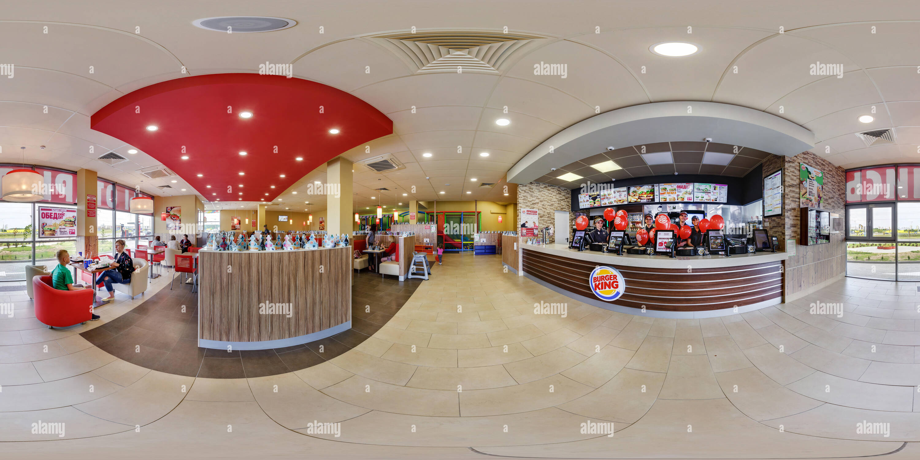 360 degree panoramic view of MINSK, BELARUS - MAY, 2017: full seamless panorama 360 degrees angle view in interior in modern elite fast food cafe burger king in equirectangular sp