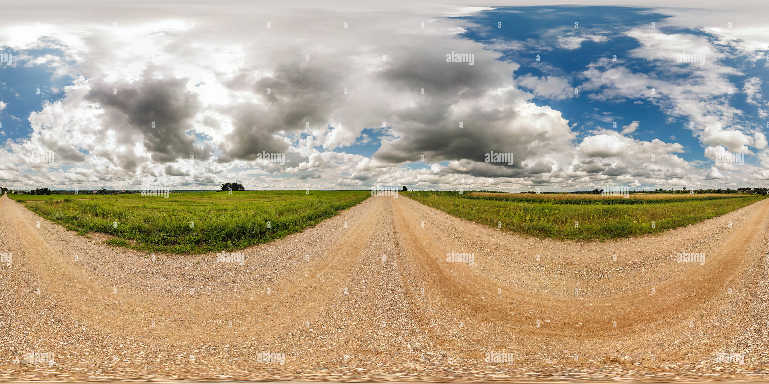 360 degree panoramic view of full seamless spherical panorama 360 by 180 degrees angle view on gravel road among fields in sunny summer day with awesome clouds in equirectangular