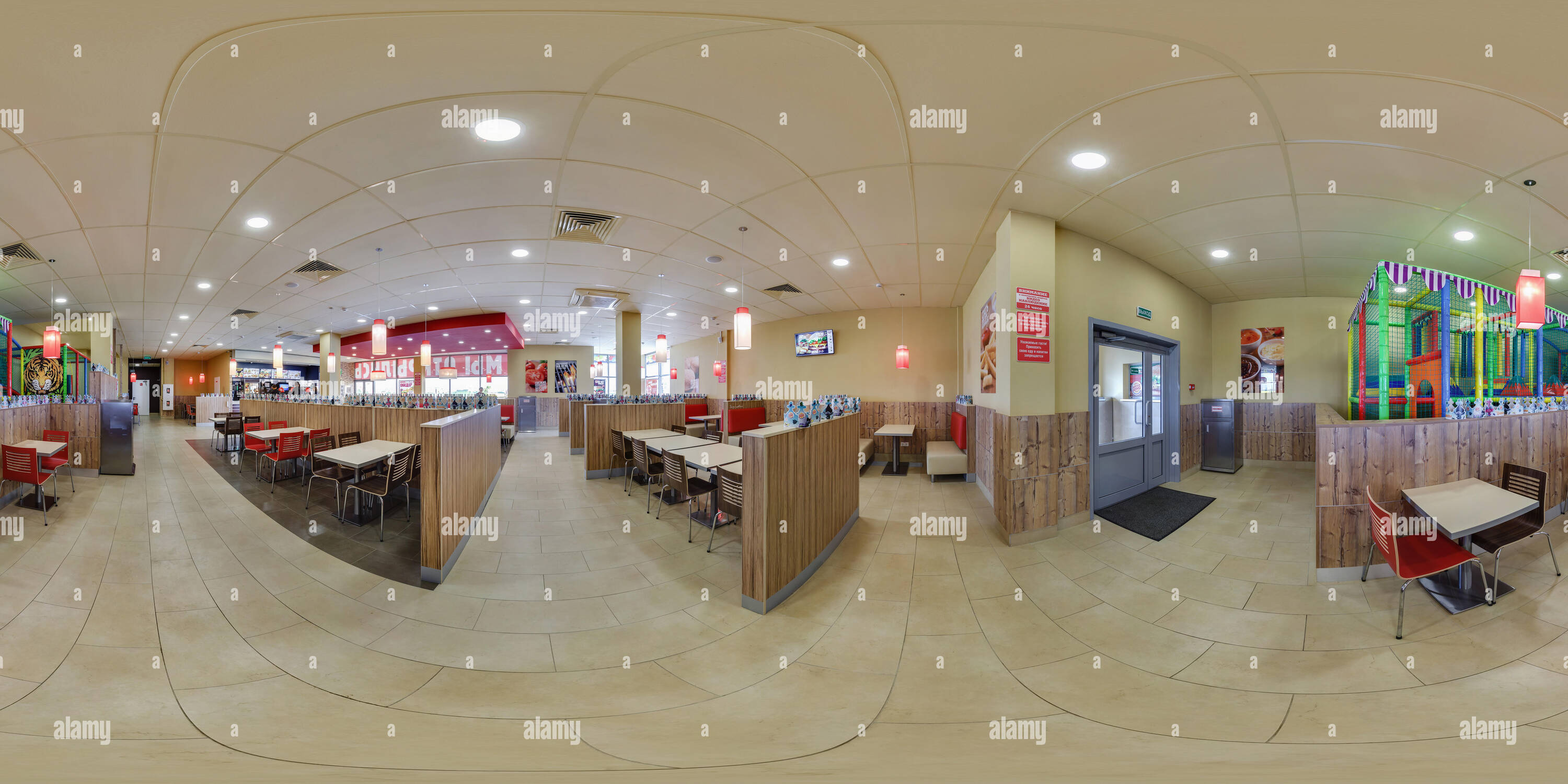 360 degree panoramic view of MINSK, BELARUS - MAY, 2017: full seamless panorama 360 degrees angle view in interior modern elite fast food cafe burger king in equirectangular spher