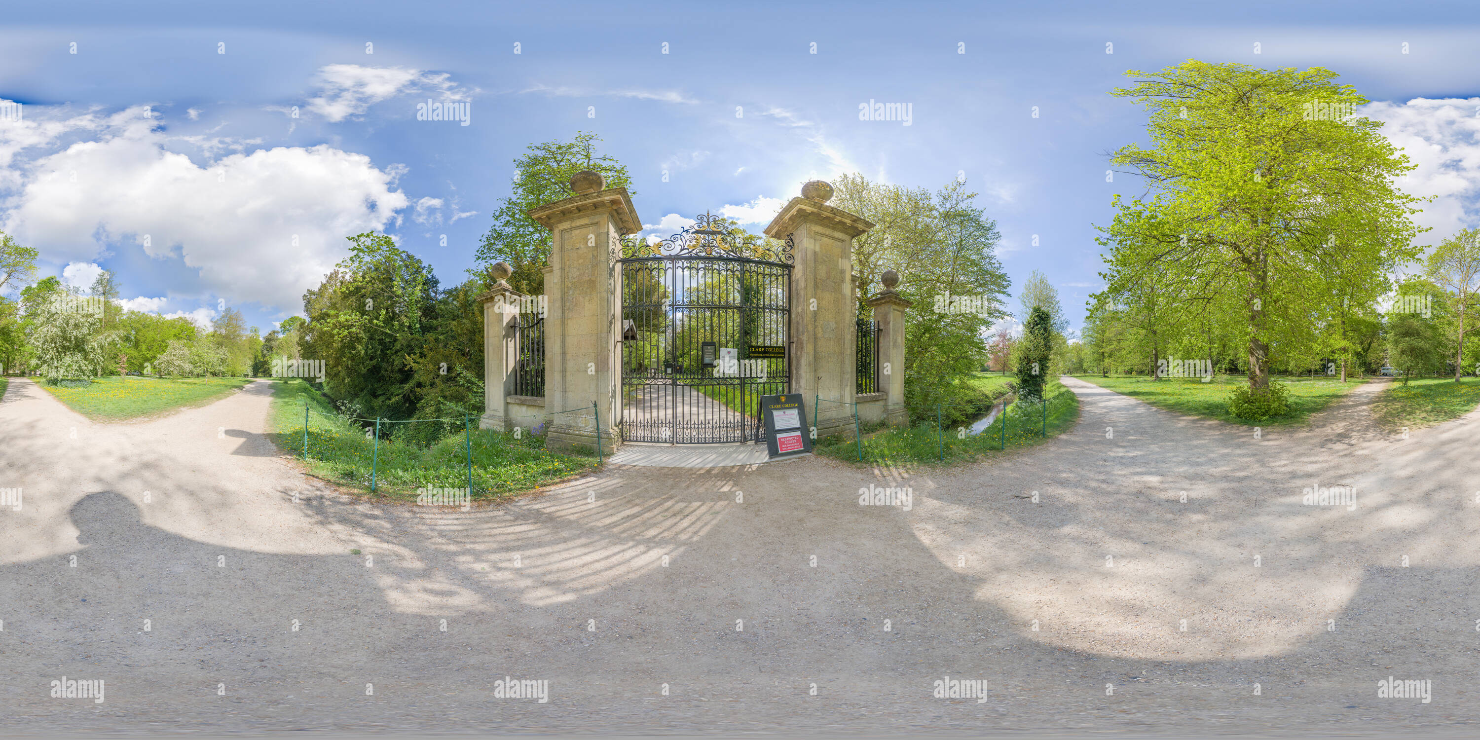 360 degree panoramic view of Rear entrance along the Backs to Clare college at Cambridge university, England, on a sunny day.