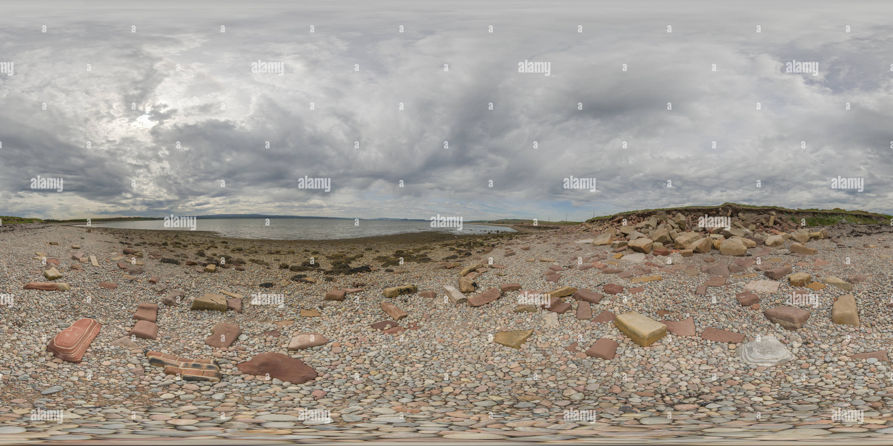 360 degree panoramic view of Pebble beach at the Fort George peninsula on the Moray Firth, opposite the lighthouse at Chanonry Point, guarding the entrance to Inverness, Scotland.