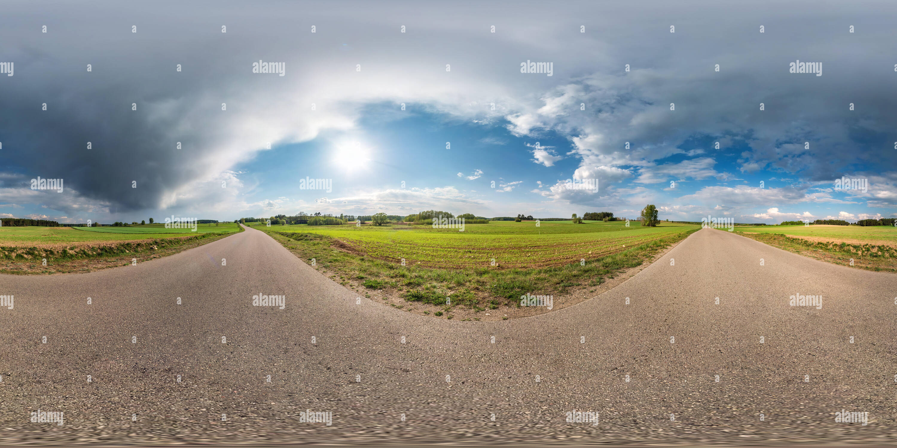360 degree panoramic view of Full spherical seamless panorama 360 degrees angle view on no traffic asphalt road among alley and fields with awesome clouds in equirectangular equid
