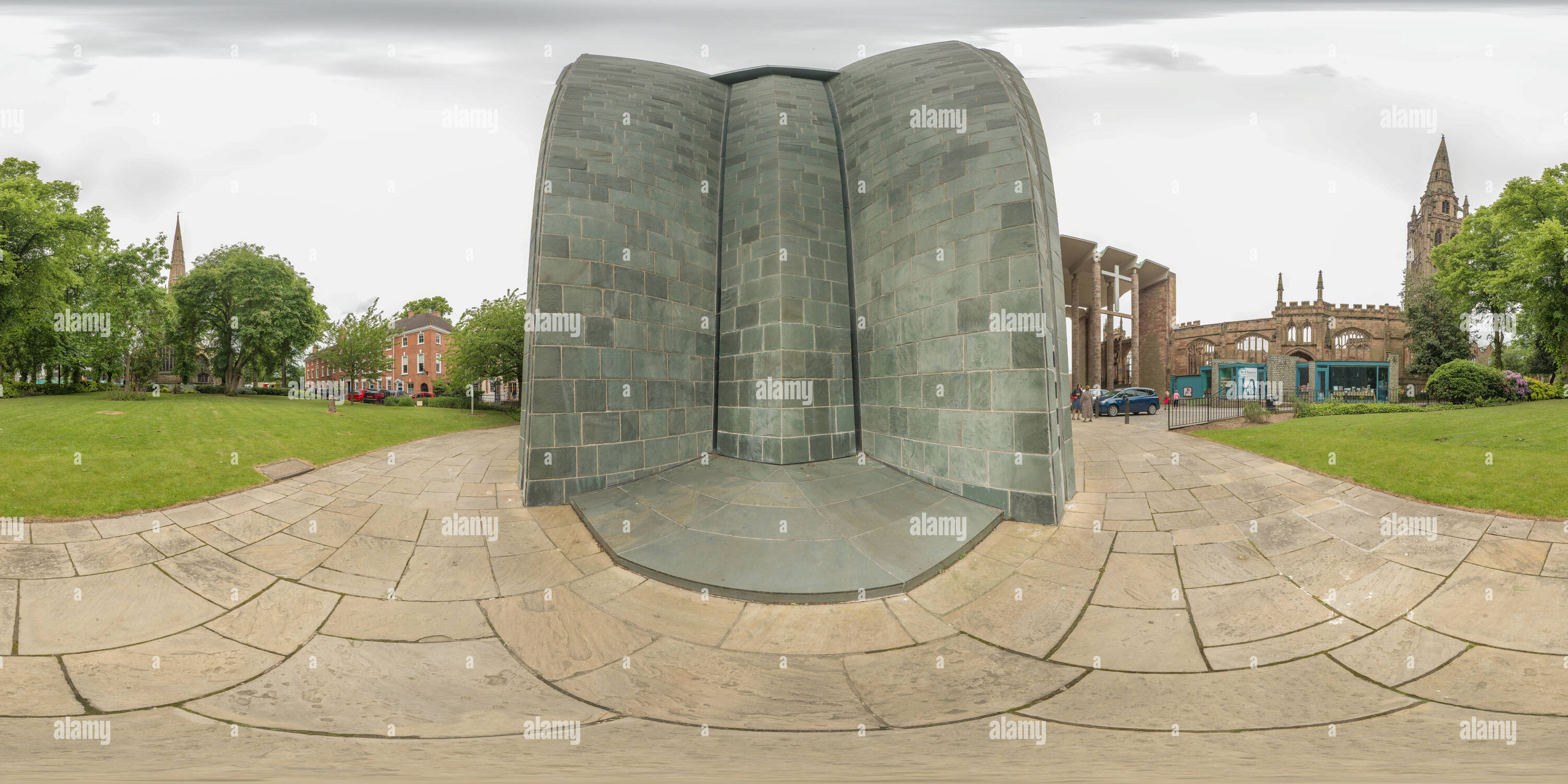 360 degree panoramic view of Exterior of the chapel of unity at Coventry cathedral, England, with the ruins of the bombed cathedral in the background.