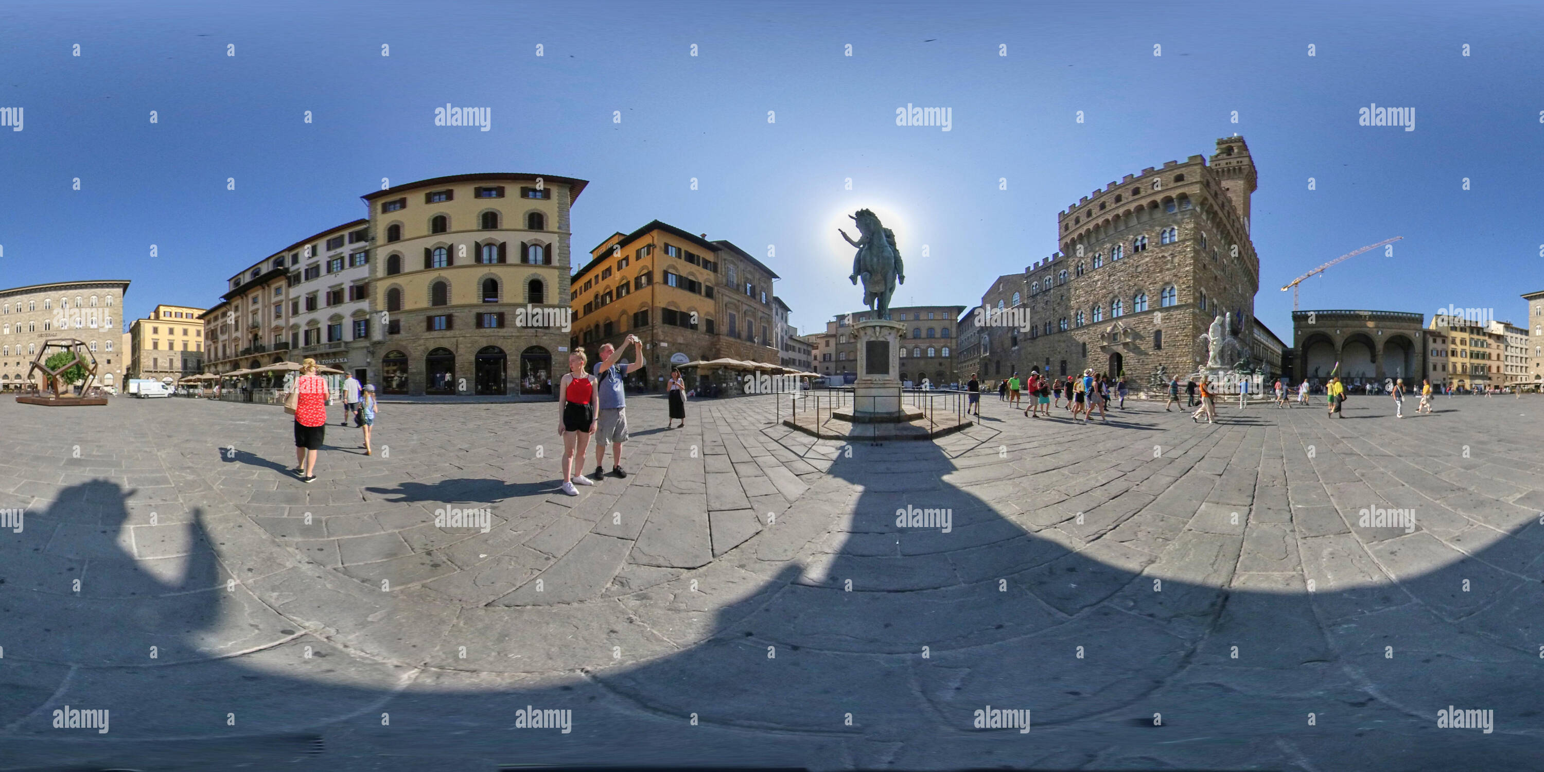 360 degree panoramic view of 360 degree shot of Piazza della Signoria with Equine monument to Cosimo I back lit in centre frame.